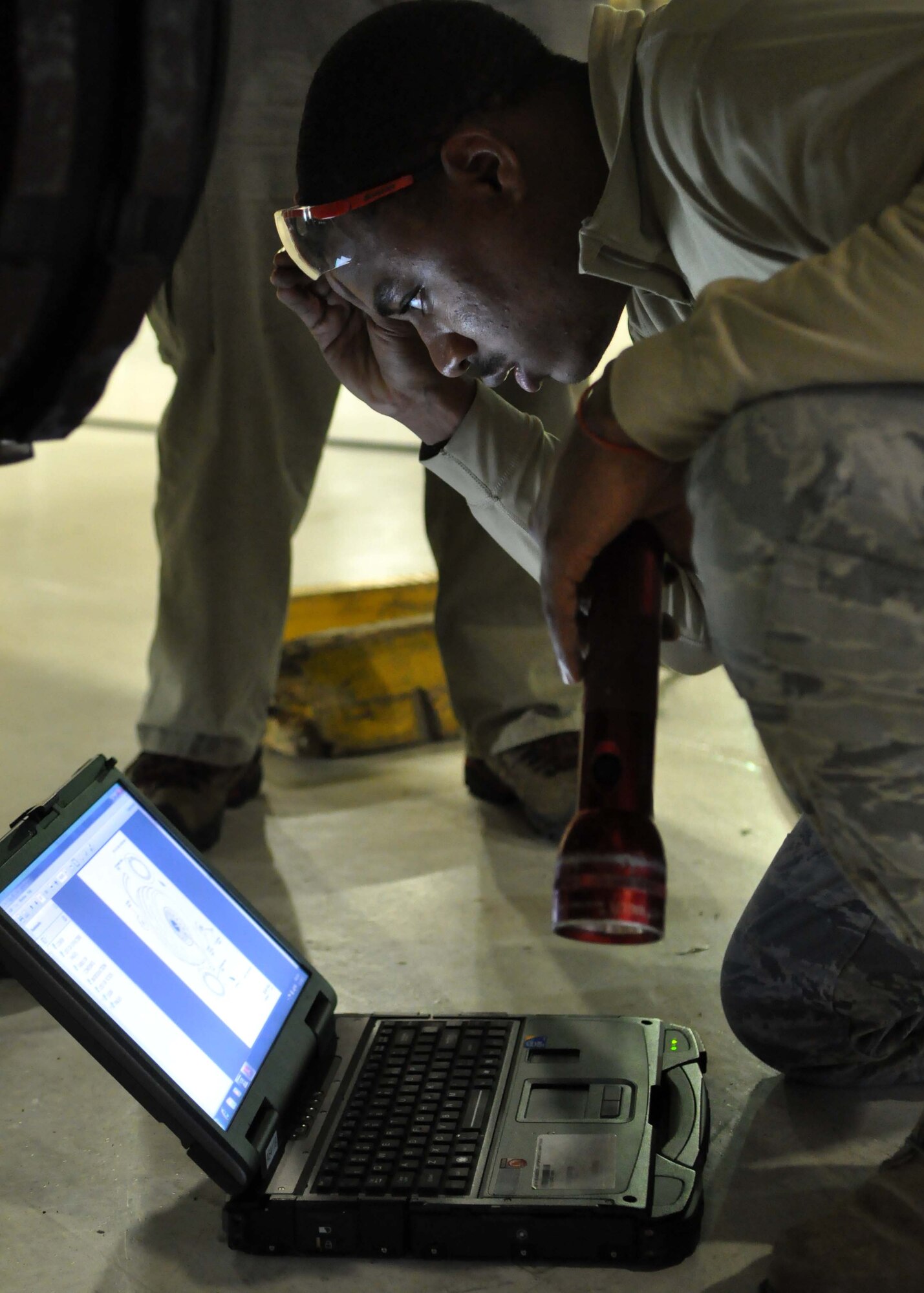 Staff Sgt. Dequan McHatten, 62nd Aircraft Maintenance Squadron crew chief, reviews a technical order before changing a tire on a C-17 Globemaster III Jan. 17, 2012, at Joint Base Lewis-McChord, Wash. Part of a crew chief’s responsibilities include maintaining, servicing and inspecting aircraft and aerospace support equipment as well as using technical data to diagnose and solve maintenance problems on aircraft systems. (U.S. Air Force photo/Airman 1st Class Leah Young)