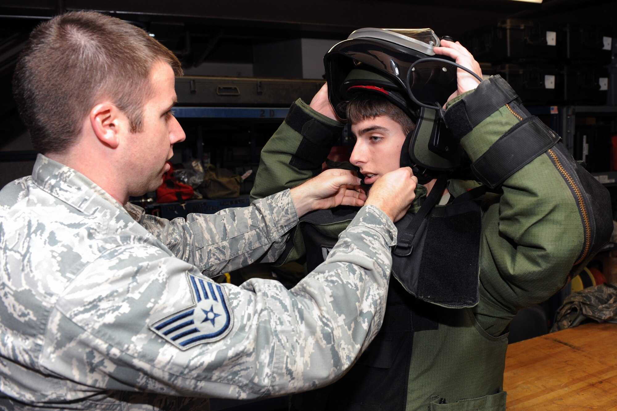 Staff Sgt. Kyle Miller and Airman 1st Class Joseph Makey, both 19th Civil Engineer Squadron Explosive Ordinance Disposal apprentices, work with the EOD-9 Bomb Suite, Jan. 19, 2012, at Little Rock Air Force Base, Ark. The 19th CES EOD conducted 328 EOD combat missions during 2010-2011, interrogating, rendering safe and disposing of more than 700 Improvised Explosive Devices. (U.S. Air Force Photo by Airman 1st Class Rusty Frank)