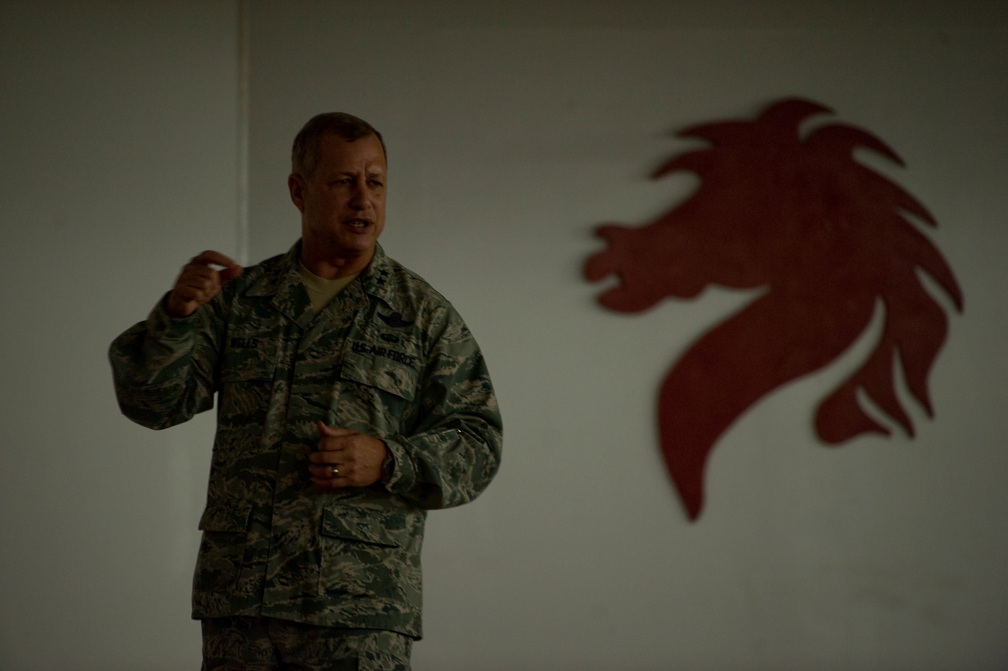 U.S. Air Force Maj. Gen. Lawrence Wells, commander of the 9th Air Force, emphasizes a point during a commander's call at the 823rd RED HORSE at Hurlburt Field, Fla., Jan. 20, 2012. The general also presented five medals for excellence as well as nine letters of appreciation during the commander's call. (Air Force photo by Airman 1st Class Hayden Hyatt/Released)