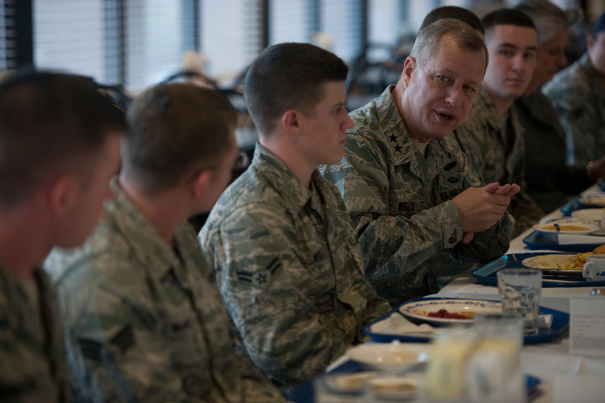 U.S. Air Force Maj. Gen. Lawrence Wells, commander of the 9th Air Force, visits with Airmen from the 823rd RED HORSE Squadron during breakfast at the Riptide Dining Facility at Hurlburt Field, Fla., Jan. 20, 2012. The general held a discussion with nearly 20 Airmen during his breakfast at the dining facility. (Air Force photo by Airman 1st Class Hayden Hyatt/Released)