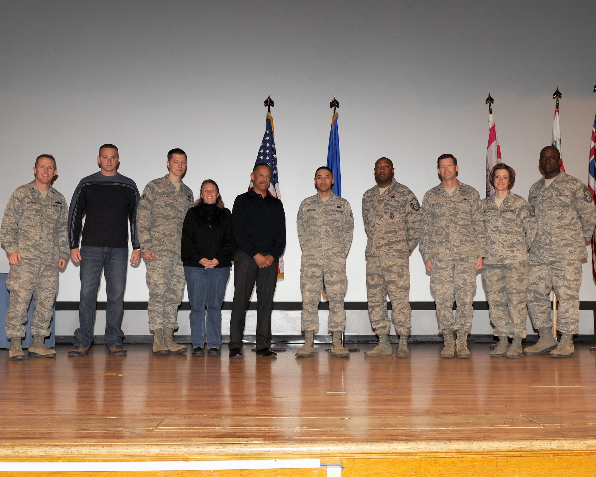 Desert Lightning Team members stand on stage following the fourth quarter awards ceremony Jan. 20, 2012 at the base theater. Each member received recognition for being the best individual performer in their category for the final quarter of 2011. (U.S. Air Force photo by Senior Airman Brittany Dowdle)