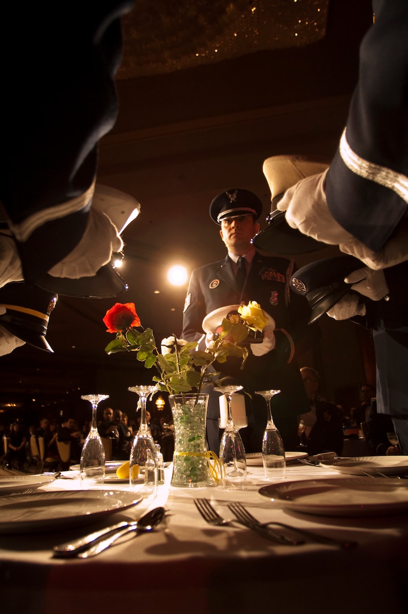 Tech. Sgt. Joshua Baker, 146th Airlift Wing Honor Guard, participates in a POW/MIA ceremony honoring those who are still missing in action or a prisoner of war, at the 2012 Outstanding Airman of the Year Banquet held at the Universal Sheraton Hotel, Universal City Calif. on January 22, 2012. (U.S. Air Force Photo by: Senior Airman Nicholas Carzis)