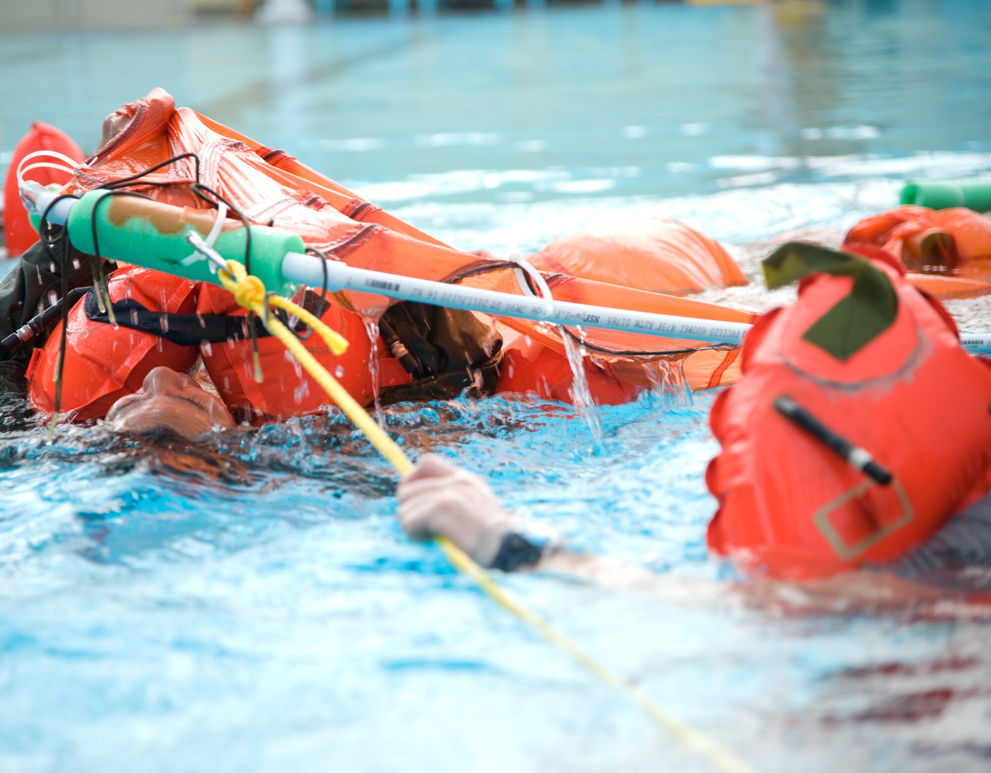 Survival students learn how to react to a parachute falling on them during s water survival class Jan. 24. (U.S. Air Force photo/Airman 1st Class Nicole Leidholm)