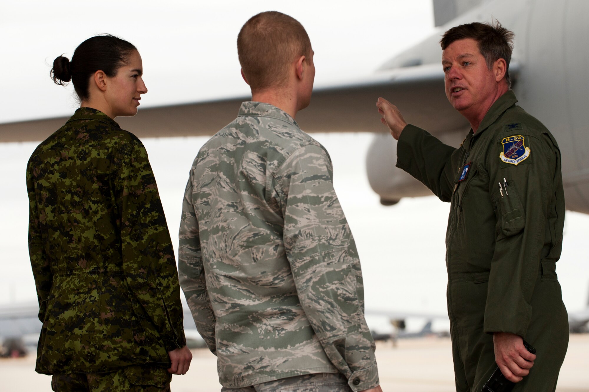 U.S. Air Force Col. Keith Schultz, 307th Operations Group commander, talks to Capt. Annie Sheink and Capt. Richard Myer about the capabilities of the B-52, Barksdale Air Force Base, La., Jan. 24, 2011. Myer is assigned to the Air Force Global Strike Command at Barksdale, and Sheink is in the Canadian Air Force and an exchange officer assigned to the Pentagon, Washington, D.C. (U.S. Air Force photo by Master Sgt. Greg Steele/Released)