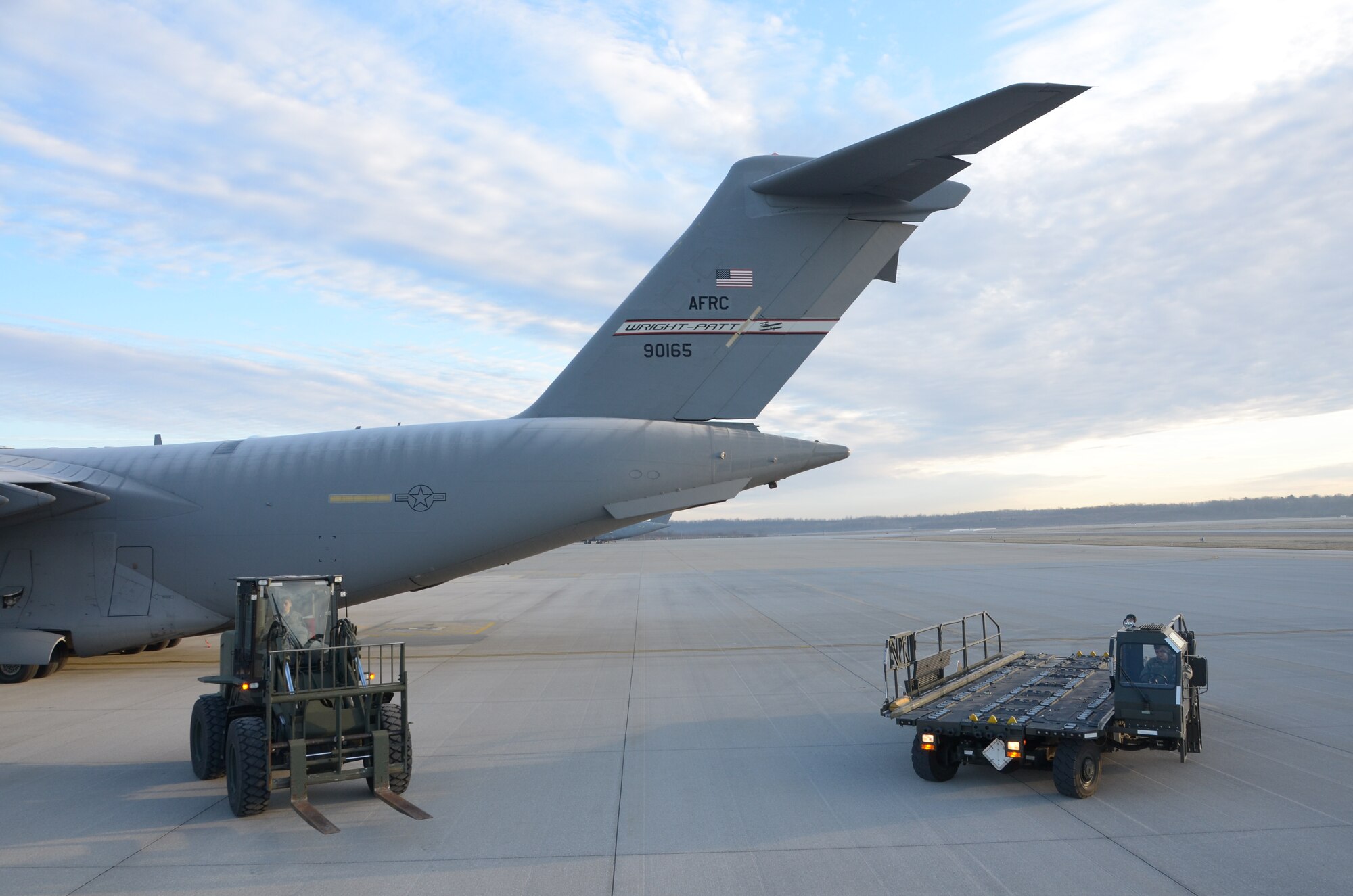 WRIGHT-PATTERSON AIR FORCE BASE, Ohio – Airmen from the 87th Aerial Port Squadron drive away in both the 25K next generation small loader and the 10K adverse terrain forlift from a 445th Airlift Wing C-17 Globemaster III after using the vehicles to load a comfort pallet onboard the aircraft for a future mission during the Jan. 8 unit training assembly. (U.S. Air Force photo/Senior Airman Mikhail Berlin)