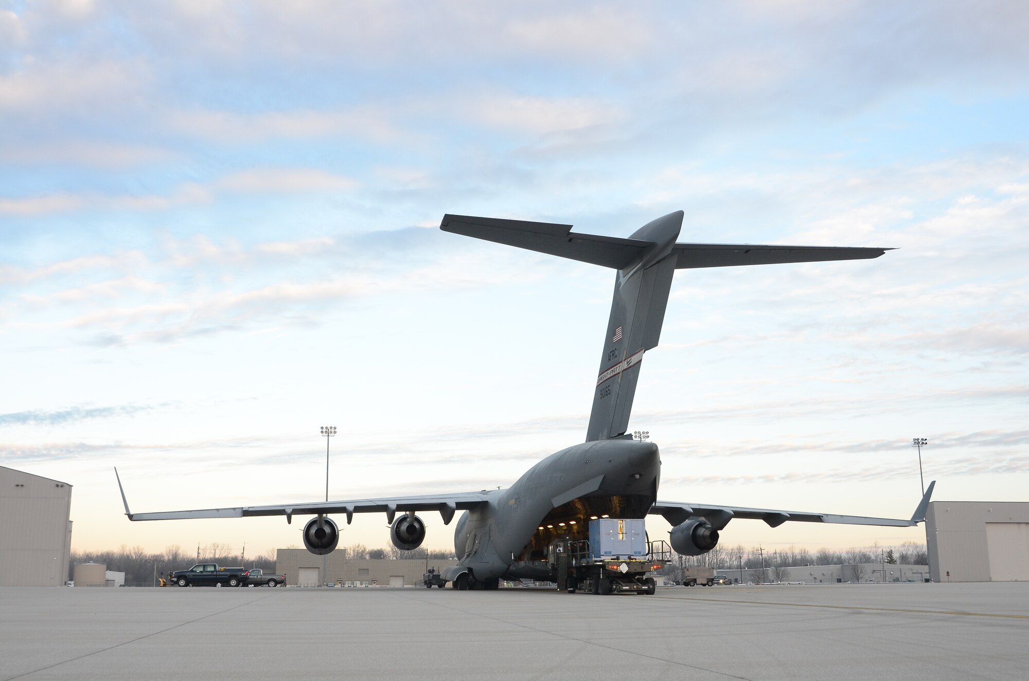 WRIGHT-PATTERSON AIR FORCE BASE, Ohio – Reservists from the 87th Aerial Port Squadron load a comfort pallet from a 25K next generation small loader onto a 445th Airlift Wing C-17 Globemaster III during the Jan. 8 unit training assembly. (U.S. Air Force photo/Senior Airman Mikhail Berlin)
