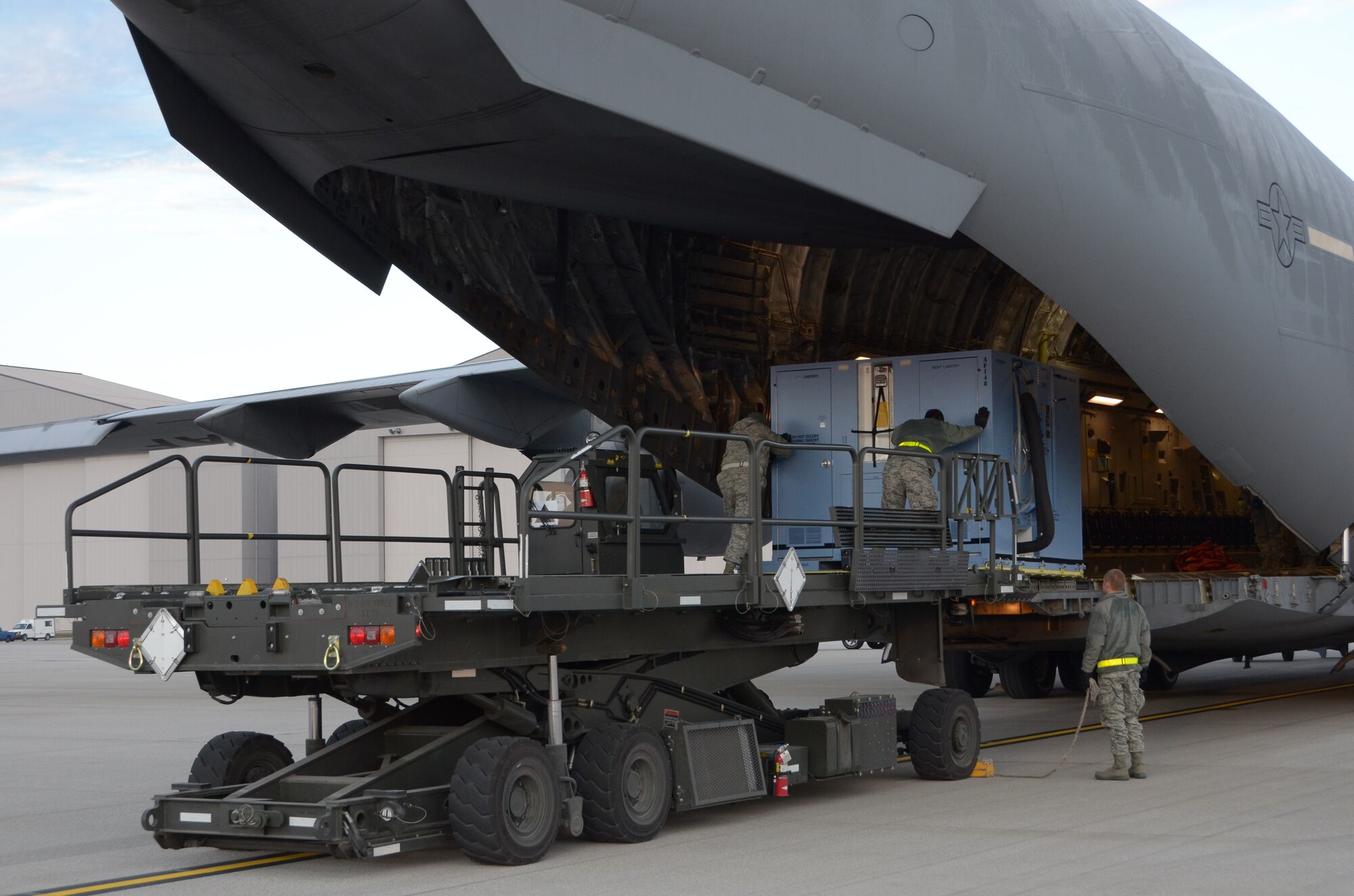 WRIGHT-PATTERSON AIR FORCE BASE, Ohio – Reservists from the 87th Aerial Port Squadron load a comfort pallet from a 25K next generation small loader onto a 445th Airlift Wing C-17 Globemaster III during the Jan. 8 unit training assembly. (U.S. Air Force photo/Senior Airman Mikhail Berlin)