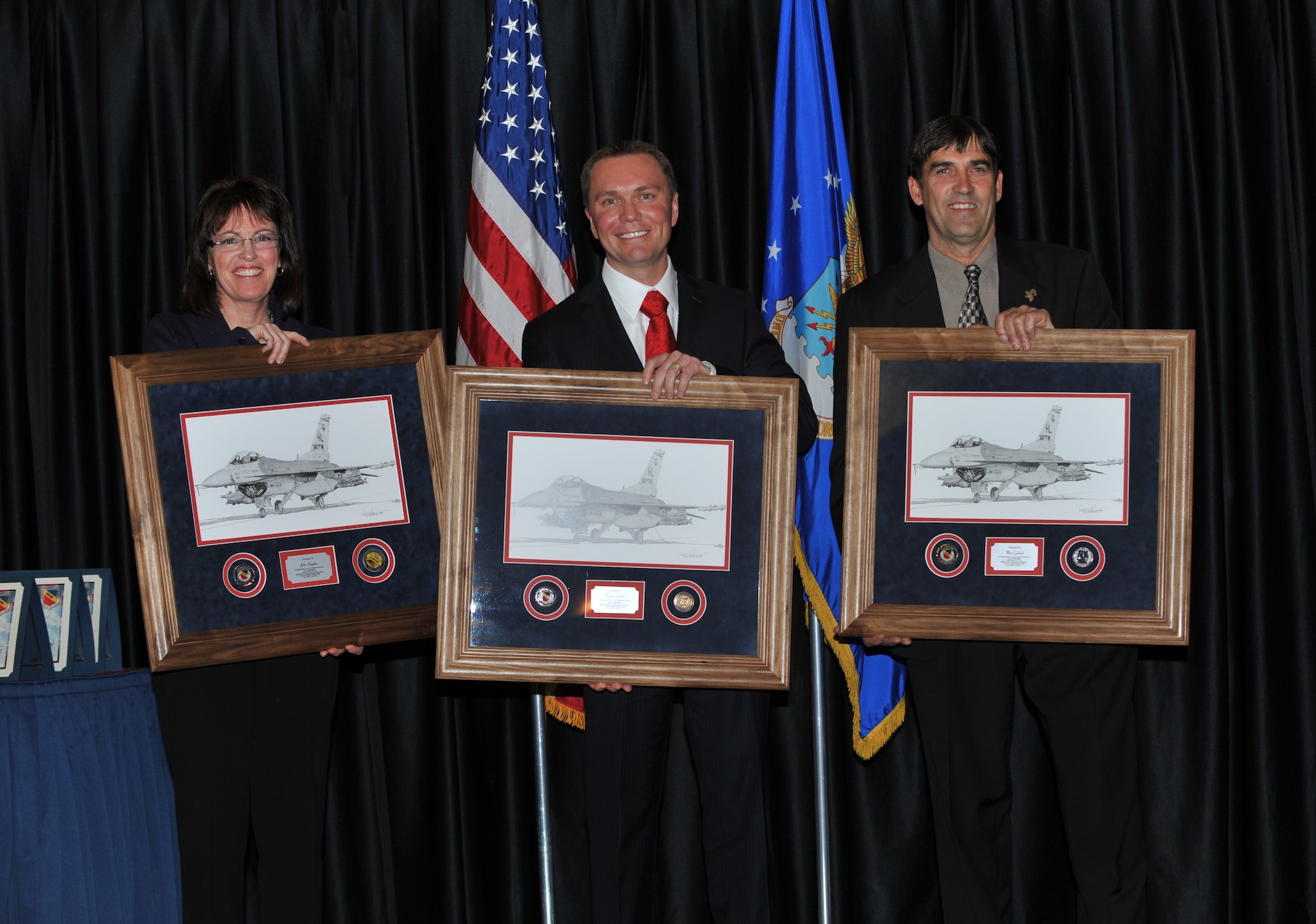 The 388th Fighter Wing outgoing honorary commanders included:  Julie Knighton, 388th Maintenance Operations Squadron; Weston Saunders, 388th Equipment Maintenance Squadron; Mark Goddard, 388th Aircraft Maintenance Squadron. Each were presented a litho from the wing commander and had an opportunity to talk about their experience during the ceremony Jan 12. (USAF photo by Kim Cook)