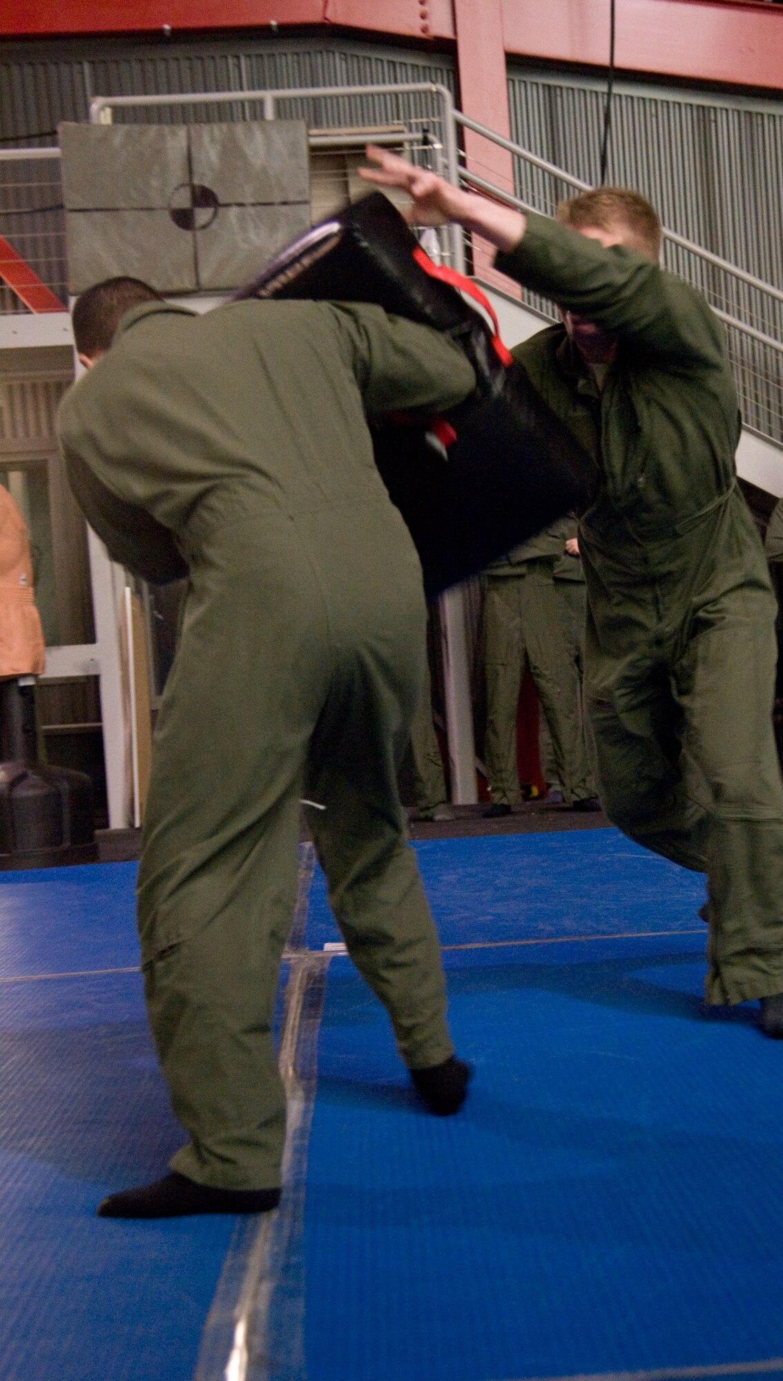 Two students practice self defense techniques they learned as a survival course Jan. 24. (U.S. Air Force photo/Airman 1st Class Nicole Leidholm)