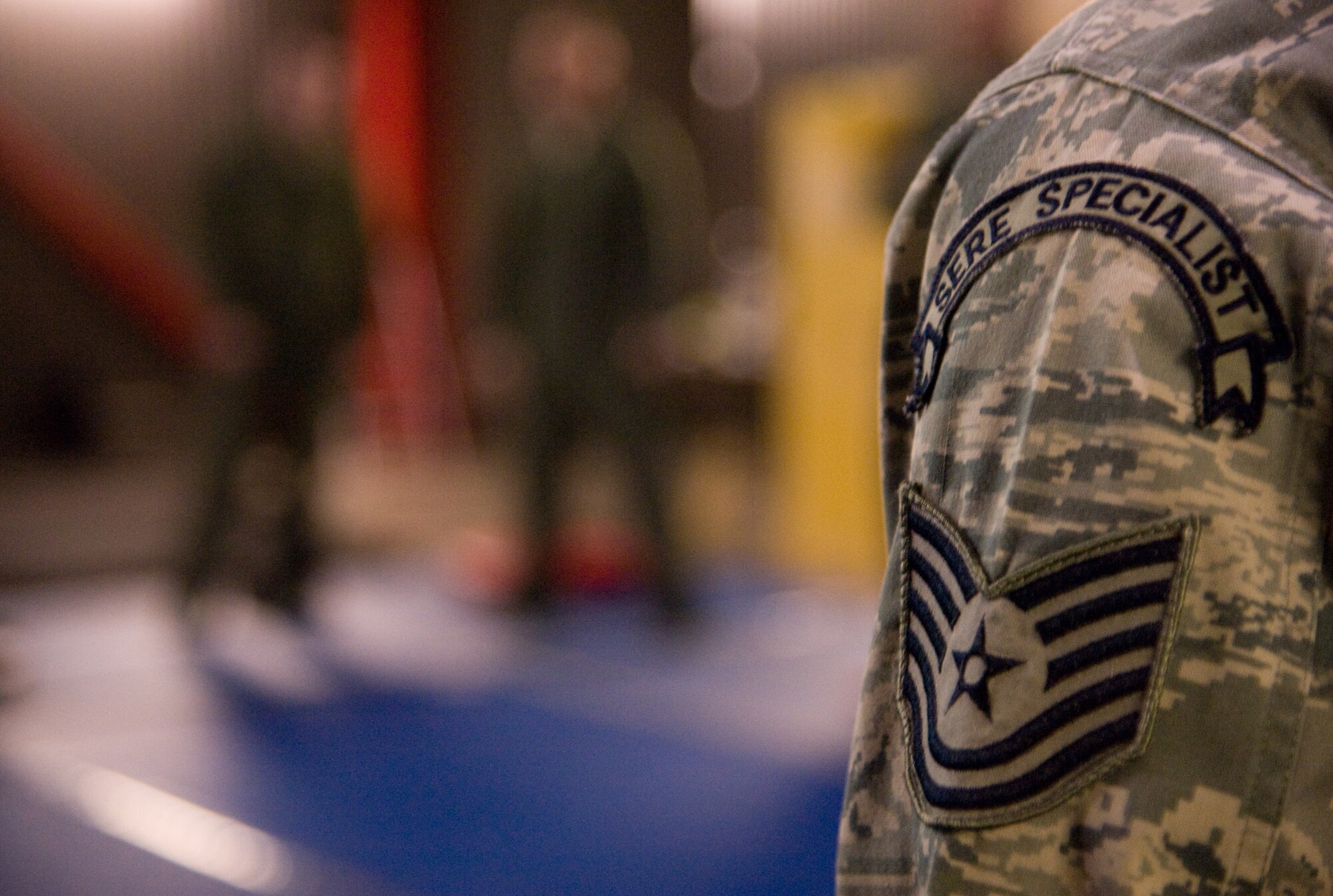 A survival instructor watches a demonstration by another instructor during a self defense lesson Jan. 24. (U.S. Air Force photo/Airman 1st Class Nicole Leidholm)