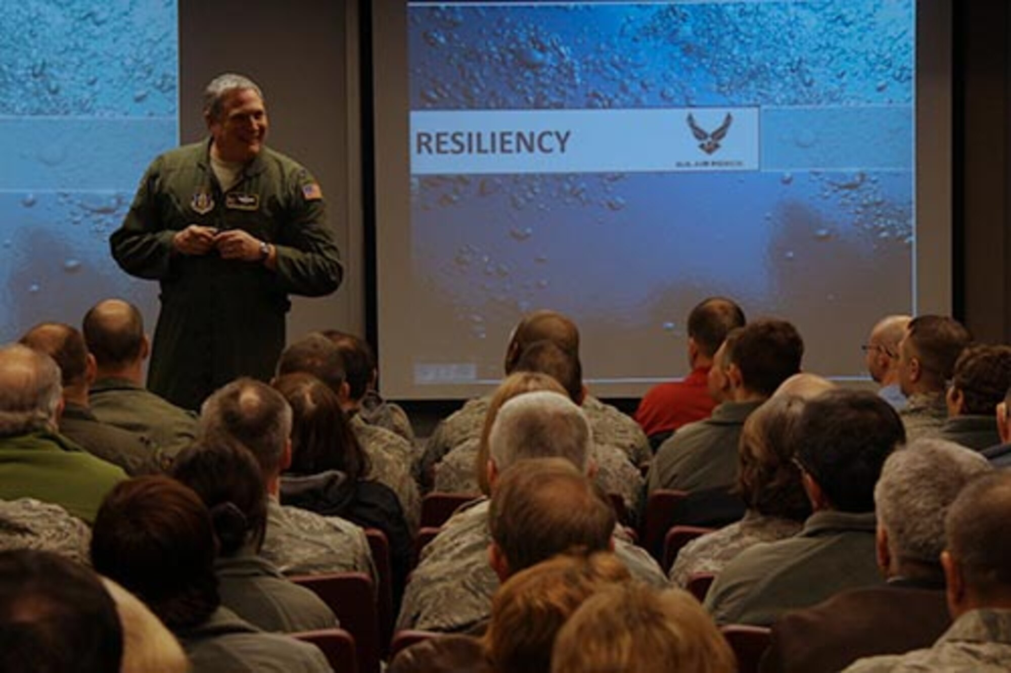 Col. Daryl J. Hartman, 911th Operations Group commander, briefs Airmen and civilians about the importance of resiliency, Jan. 25, 2012.  The Air Force describes resiliency as the ability to withstand, recover and grow in the face of stressors and changing demands. The Air Force’s goal is to encourage Wingmen to be watchful and flexible by devoting time into individual, small group and unit discussions, and to enhance those skills and strategies for complex situations. ( U.S. Air Force photo by Tech. Sgt. Ralph Van Houtem/Released)