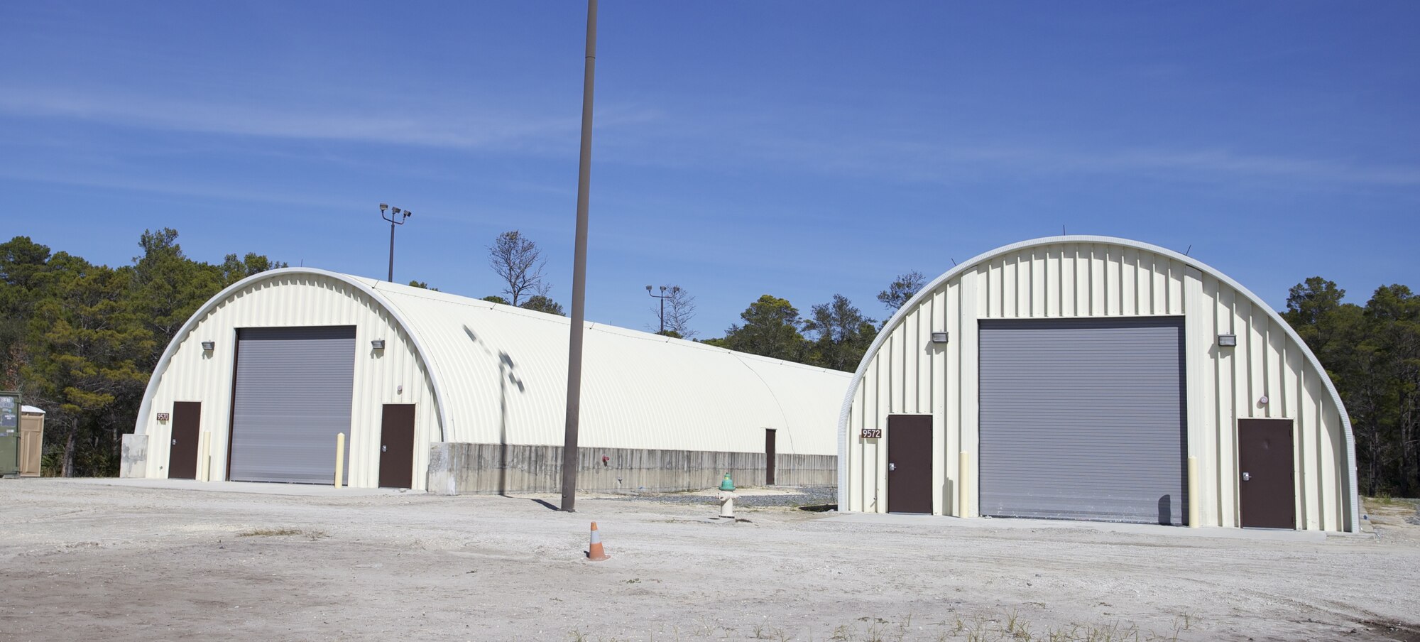 Engineers and researchers intend to use these two buildings located at the Silver Flag Exercise Site at Tyndall AFB, Fla. in a test to determine the heat reflectivity value of a ceramic coating.  The building on the left will receive the ceramic coating on its roof while the building on the right will remain "as-is." (U.S. Air Force/photo by Mr. Eddie Green)

