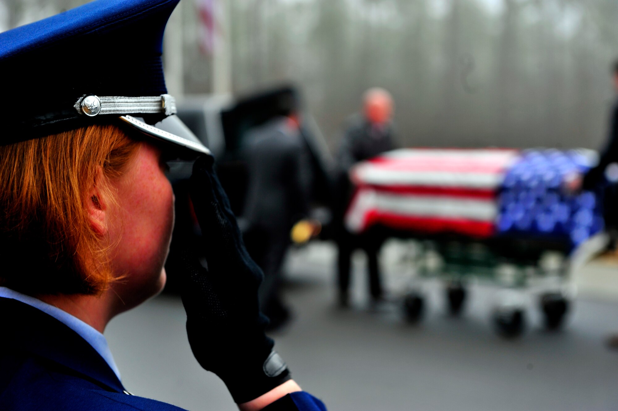 U.S. Air Force Tech Sgt. Rachel Hill, Honor Guard noncommissioned officer in charge, salutes a deceased veteran for a funeral service at Ft. Jackson National Cemetery, S.C. Jan. 23, 2011. Shaw’s Honor Guard provides funeral service details, and other services to four states, 75 counties, and approximately five million residents.  (U.S. Air Force photo/Senior Airman Neil D. Warner)(Released)