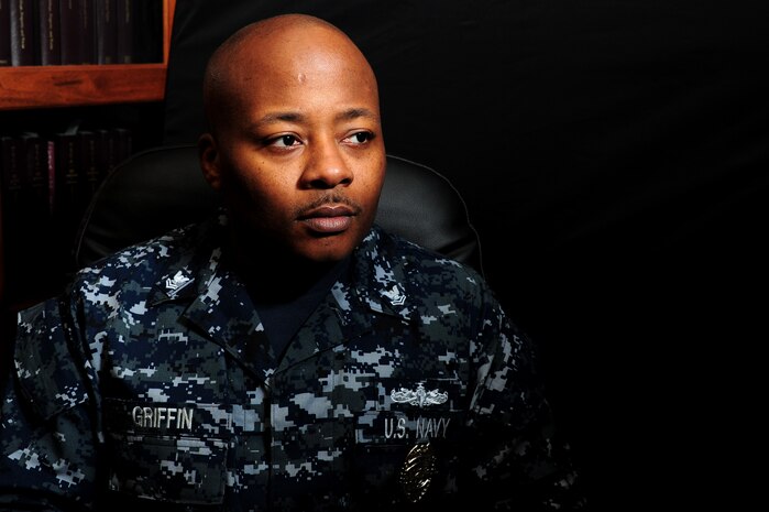 Petty Officer 1st Class Nicus Griffin reflects on his Individual Augmentee deployments, Jan. 1, at Joint Base Charleston - Weapons Station. There were more than 8,000 Navy IA deployments last year taking Sailors to 14 different locations from Central America to the Middle East to serve in an array of different combat support roles. Griffin recently returned from a one-year IA deployment to Guantanomo Bay, Cuba. Griffin is a Master-at-Arms assigned to the 628th Security Forces Squadron.  (U.S. Air Force photo/ Staff Sgt. Nicole Mickle)  