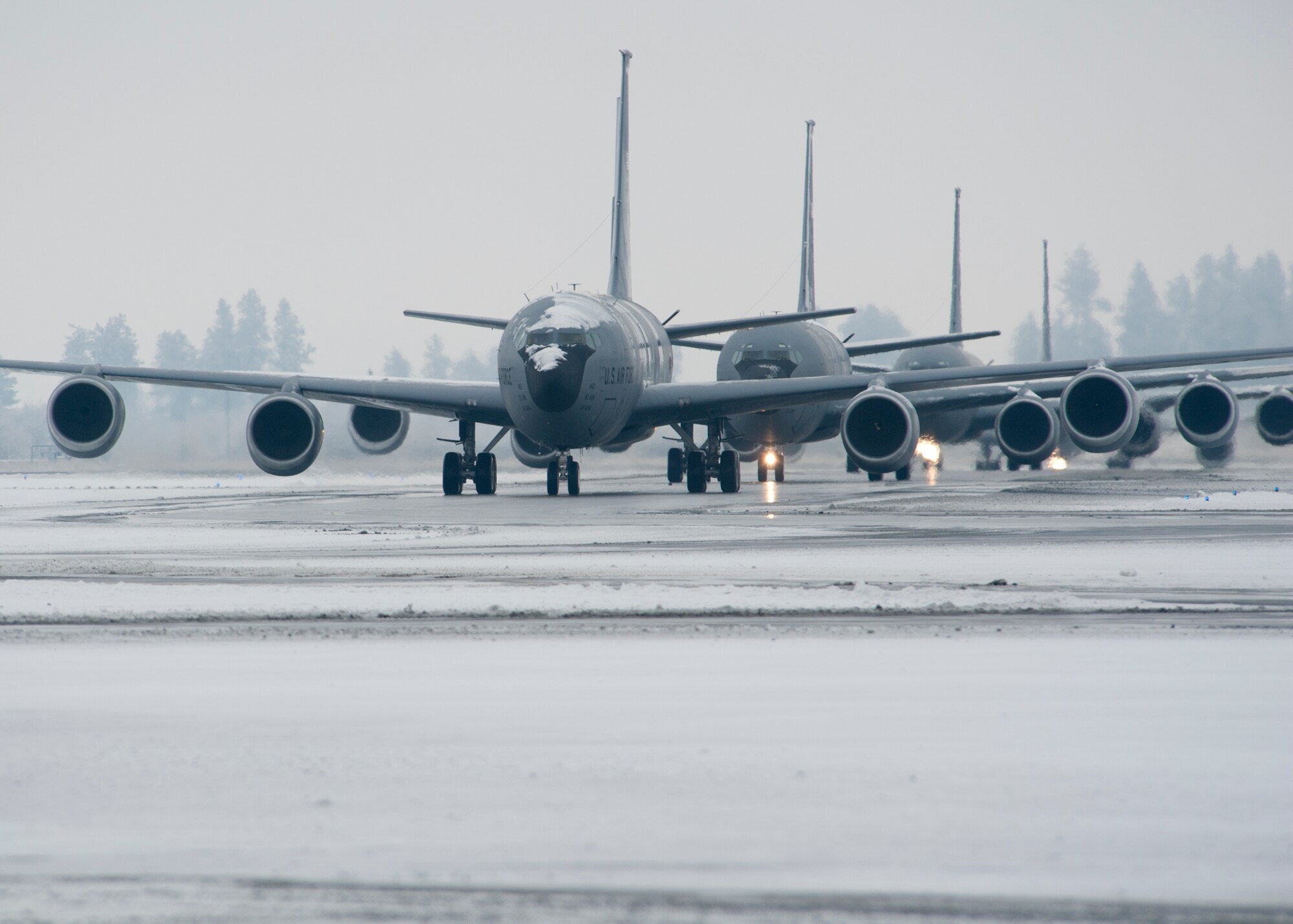 KC-135 Stratotanker refueling aircraft taxi on the flightline during snowy weather at Fairchild Air Force Base, Wash., Jan. 20, 2012. The Stratotanker is the primary aircraft at Fairchild, which relies heavy on the weather predictions of the 92nd Operations Support Squadron weather shop for accurate up-to-date flying conditions. (U.S. Air Force photo by Staff Sgt. Michael Means)