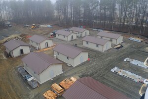 Buildings await completion at the Raptor Town construction site at Langley Air Force Base, Va., Jan., 23, 2012. The old raptor town was demolished, and the new training site is being rebuilt to provide a permanent area that accurately resembles a deployed location. (U.S. Air Force photo by Staff Sgt. Ashley Hawkins/Released)