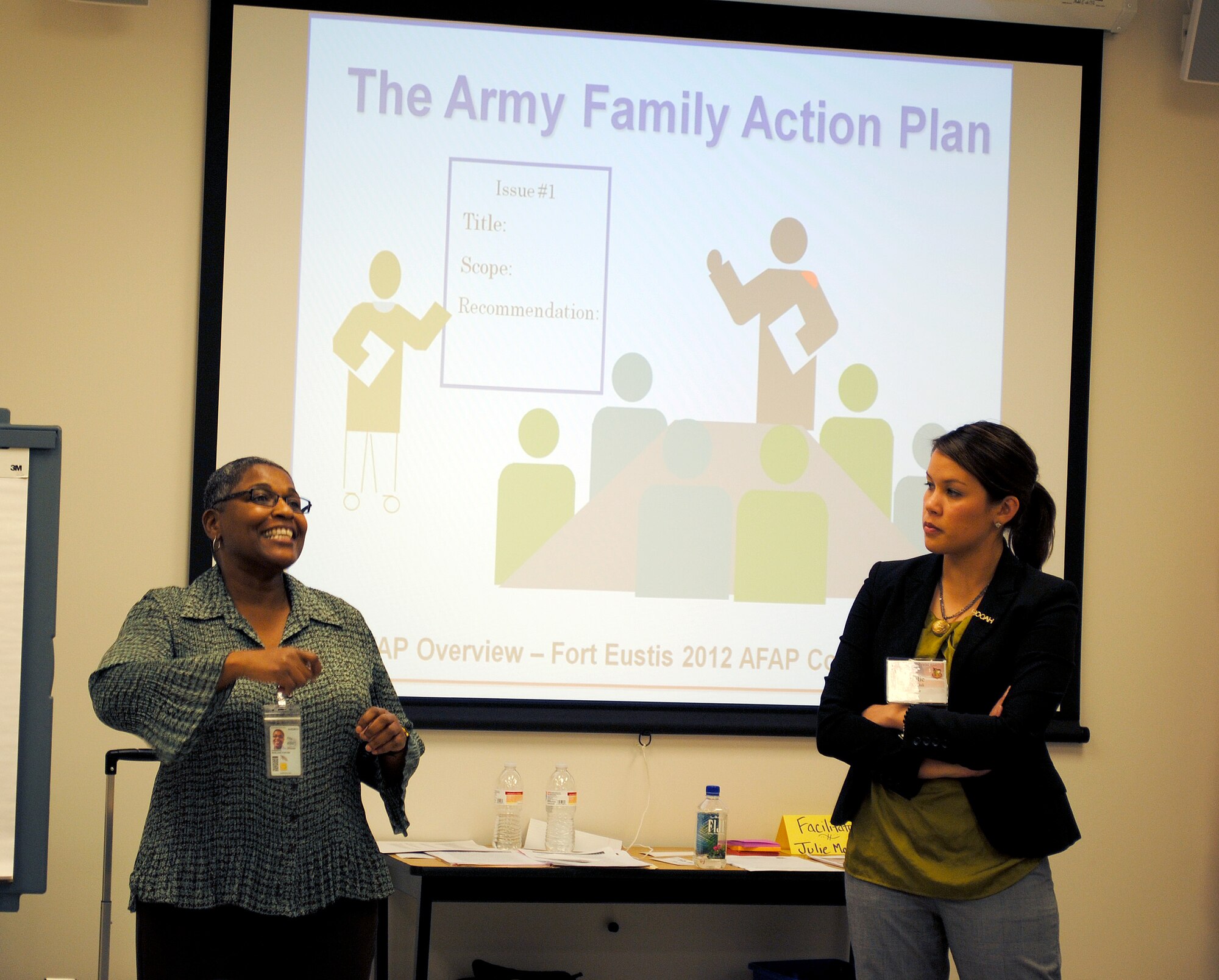 Marlene Foster Cherrye (left), Exceptional Family Member Program manager, talks to Group 1 as a subject matter expert on the Army Family Action Plan Jan. 18. Julie Machak (right) acted as the group facilitator during the three-day conference at Fort Eustis. (U.S. Army photo by Toni Guagenti/Released)