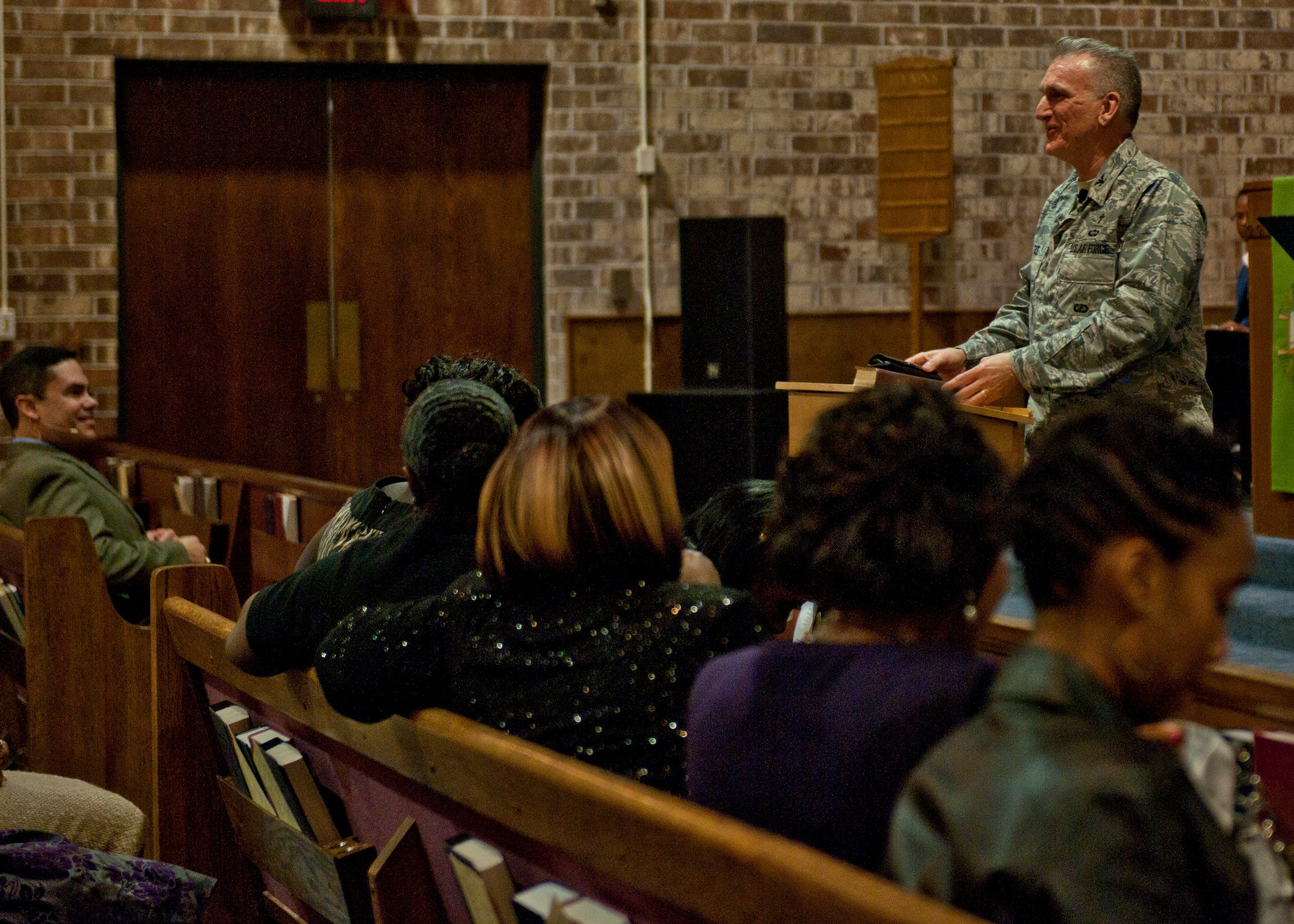 U.S. Air Force Col. Gregory Tate, Air Combat Command chaplain, takes the podium to preach during a Gospel service at the Moody Chapel, Moody Air Force Base, Ga., Jan. 22, 2012. Tate also spoke during a Contemporary service and ate breakfast with members of the Protestant community. He visited Moody to meet with the base’s chapel members and get a better understanding of the services they offer. (U.S. Air Force photo by Senior Airman Eileen Meier/Released)
