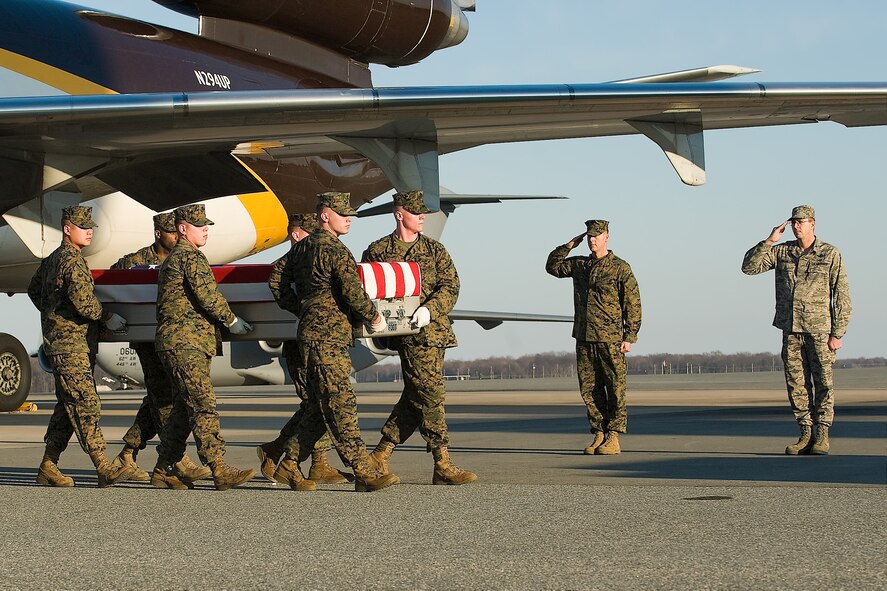 A U.S. Marine Corps carry team transfers the remains of Marine Cpl. Christopher G. Singer, of Temecula, Calif., at Dover Air Force Base, Del., Jan. 24, 2012. Singer  was assigned to the 3rd Combat Engineer Battalion, 1st Marine Division, I Marine Expeditionary Force, Twentynine Palms, Calif. (U.S. Air Force photo/Steve Kotecki)