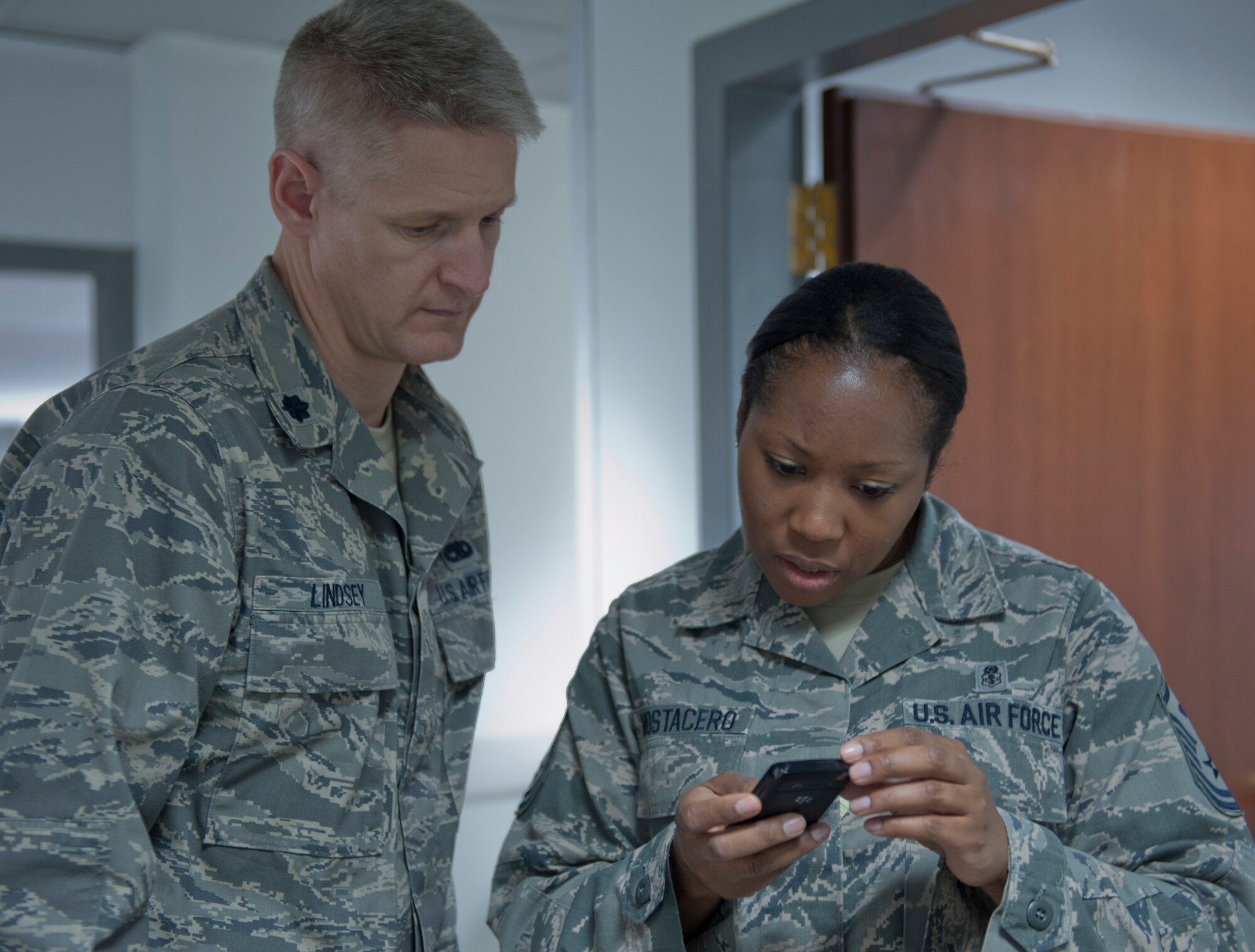 Master Sgt. Anitra Mostacero, 728th Air Mobility Squadron first sergeant, right, and Lt. Col. Brian Lindsey, 728th AMS commander, review an e-mail Dec. 16, 2011, at Incirlik Air Base, Turkey. This is Mostacero's seventh squadron as a first sergeant. (U.S. Air Force photo by Senior Airman Anthony Sanchelli/Released)
