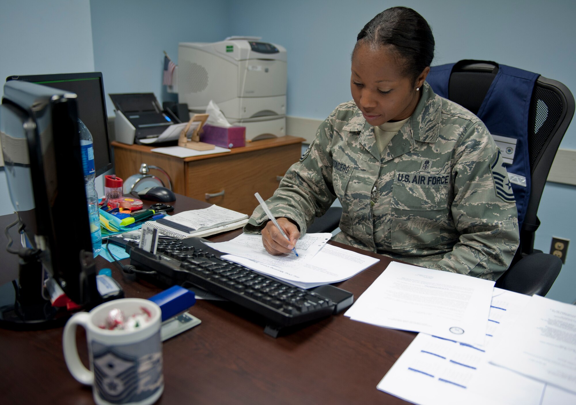 Master Sgt. Anitra Mostacero, 728th Air Mobility Squadron first sergeant, reviews forms and memorandums Dec. 16, 2011, at Incirlik Air Base, Turkey. This is Mostacero's seventh squadron as a first sergeant. (U.S. Air Force photo by Senior Airman Anthony Sanchelli/Released)
