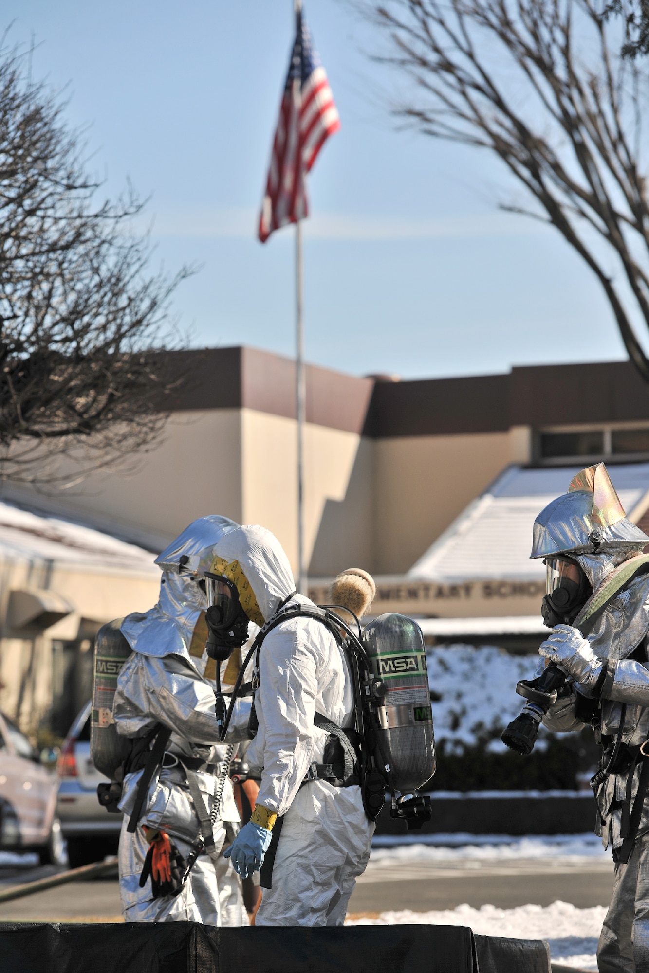 YOKOTA AIR BASE, Japan -- Yokota firefighters perform decontamination procedures during an emergency management exercise at Yokota Air Base, Japan, Jan. 25, 2012. Yokota airmen use exercises to maintain operational readiness capabilities. (U.S. Air Force photo/Osakabe Yasuo)