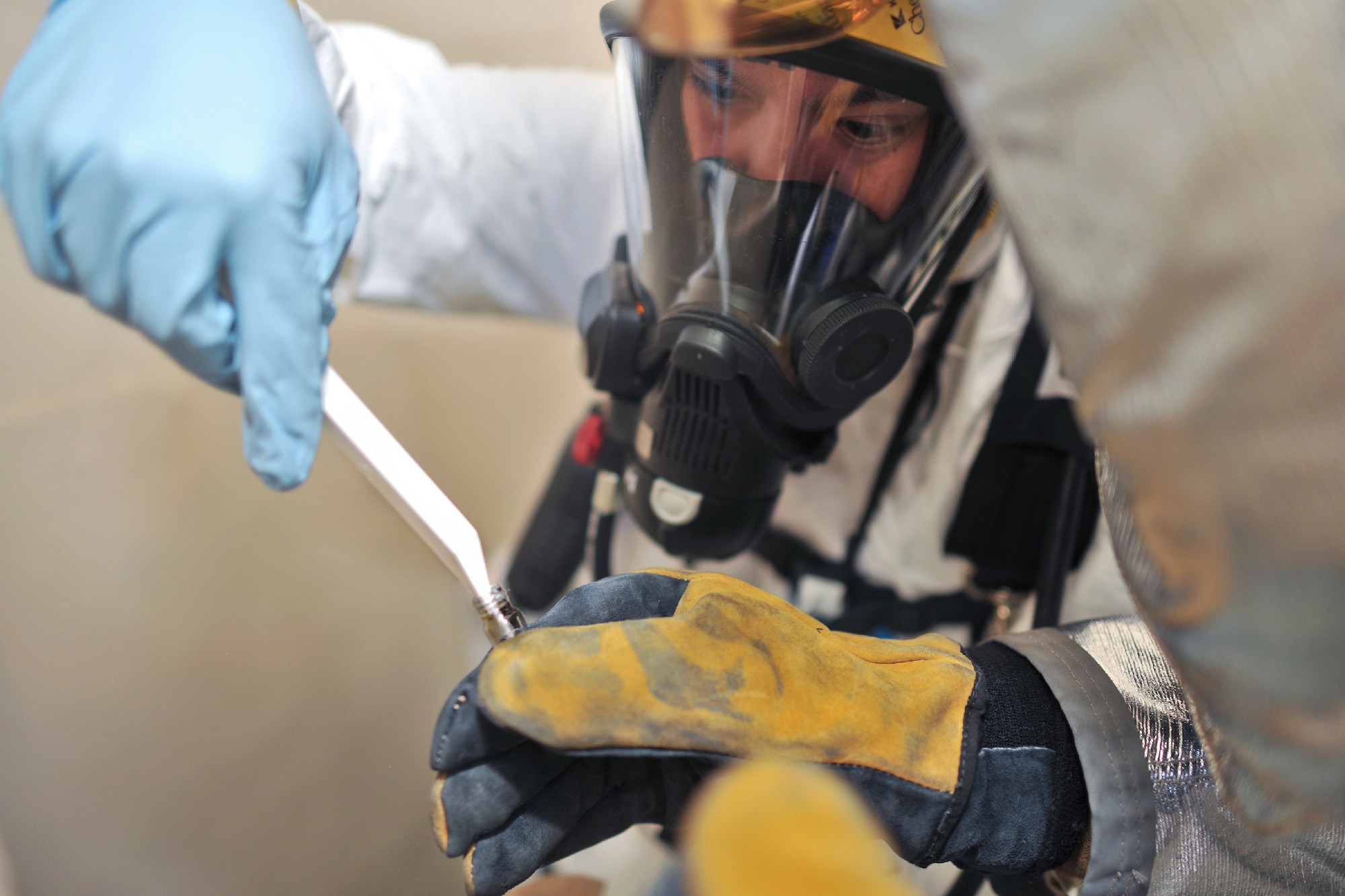YOKOTA AIR BASE, Japan -- Staff Sgt. Michael Ona, 374th Aerospace Medicine Squadron bioenvironmental engineer technician, collects simulated unknown substances during an emergency management exercise at Yokota Air Base, Japan, Jan. 25, 2012. Yokota airmen use exercises to maintain operational readiness capabilities. (U.S. Air Force photo/Osakabe Yasuo)