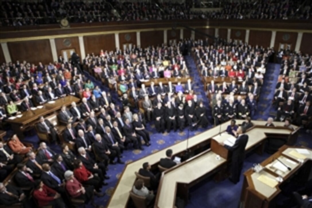 President Barack Obama praises U.S. service members as he delivers the State of the Union address in the House Chamber at the U.S. Capitol in Washington, D.C., Jan. 24, 2012.