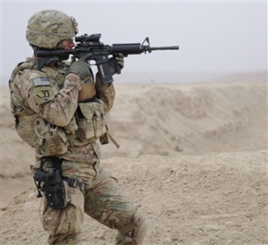 U.S. Army Capt. Devin Ciminero, a Kandahar Provincial Reconstruction Team security force company commander with 1st Platoon, Alpha Company, 1st Battalion, 182nd Infantry Regiment, Rhode Island National Guard, scans his sector while providing security during a site assessment of the Dowry Rud Check Dam in Kandahar province, Afghanistan, on Jan. 21, 2012.  