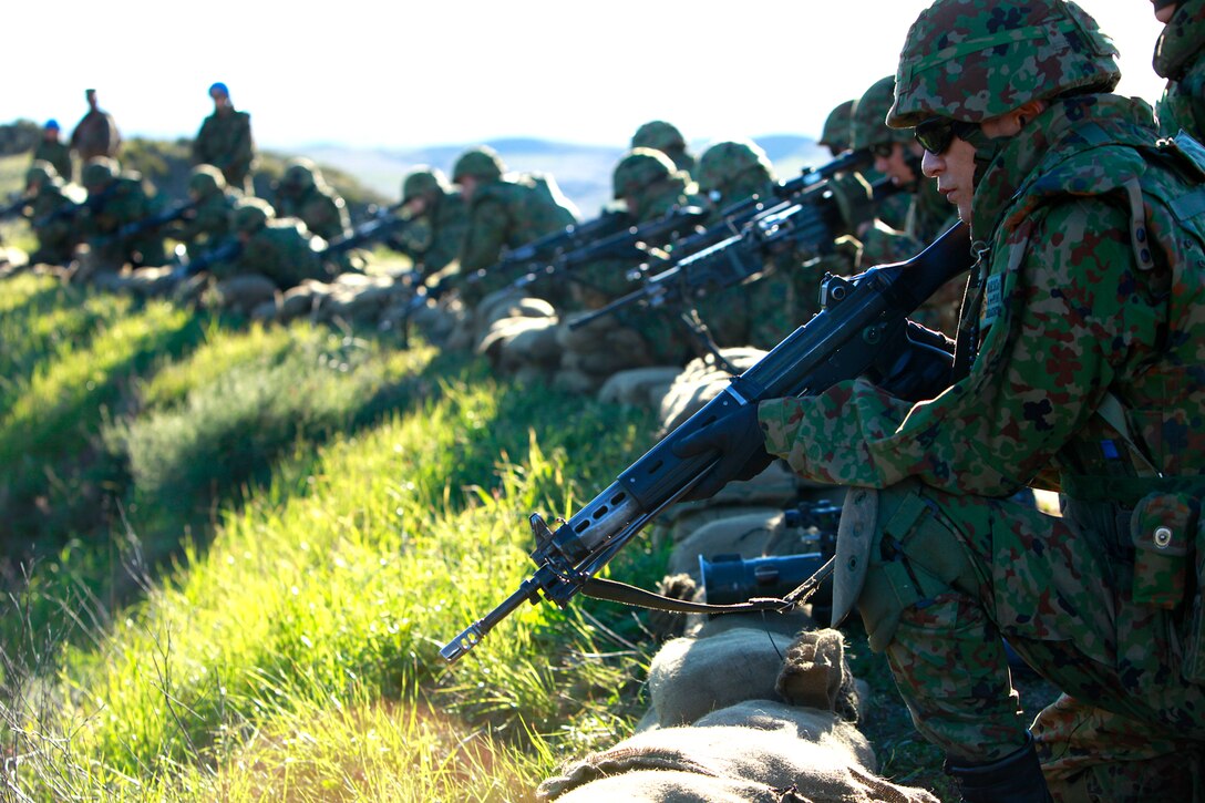Soldiers with the Japanese Ground Self Defense Force sight in on targets at Range 222 on Camp Pendleton, Jan. 25. The training was planned in a crawl, walk, run format, designed to build confidence in the soldiers’ with their weapons. The 5-day evolution was a part of Exercise Iron Fist 2012, a bilateral training opportunity for the 15th Marine Expeditionary Unit and the JGSDF. (U.S. Marine Corps photo by Cpl. John Robbart III)