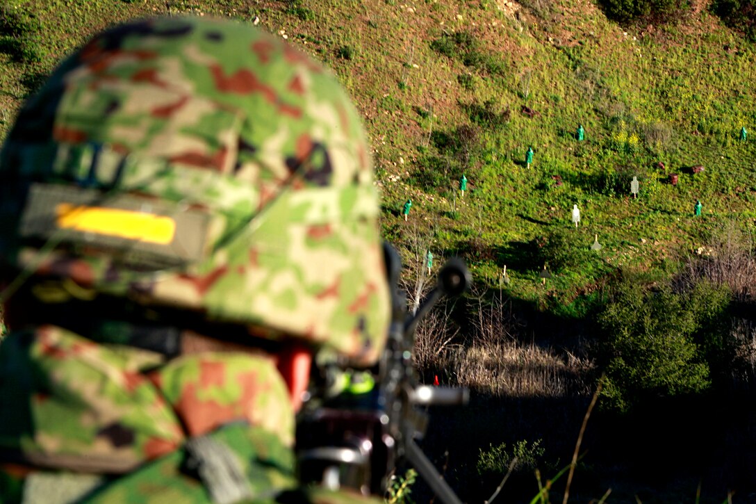 A soldier with the Japanese Ground Self Defense Force sight in on targets at Range 222 on Camp Pendleton, Jan. 25. The training was planned in a crawl, walk, run format, designed to build confidence in the soldiers’ with their weapons. The 5-day evolution was a part of Exercise Iron Fist 2012, a bilateral training opportunity for the 15th Marine Expeditionary Unit and the JGSDF. (U.S. Marine Corps photo by Cpl. John Robbart III)