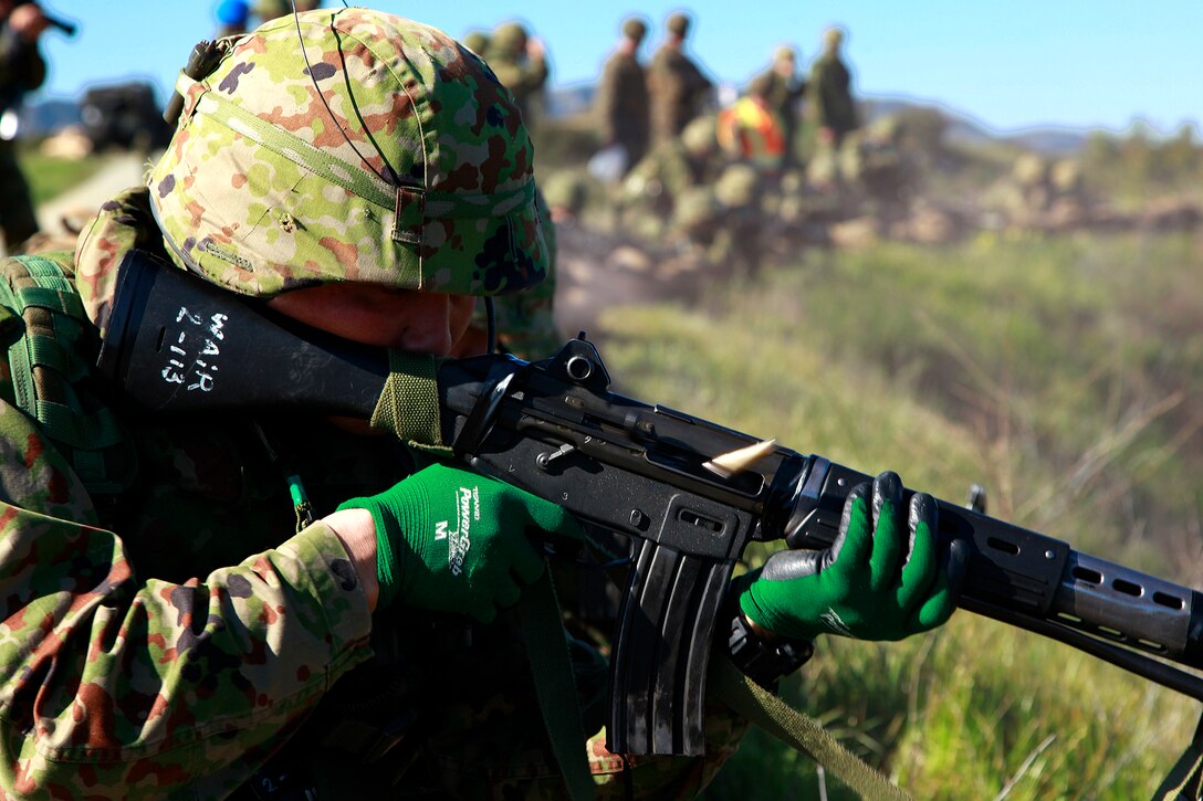 A soldier with the Japanese Ground Self Defense Force fires at a target at Range 222 on Camp Pendleton, Jan. 25. The training was planned in a crawl, walk, run format, designed to build confidence in the soldiers’ with their weapons. The 5-day evolution was a part of Exercise Iron Fist 2012, a bilateral training opportunity for the 15th Marine Expeditionary Unit and the JGSDF. (U.S. Marine Corps photo by Cpl. John Robbart III)