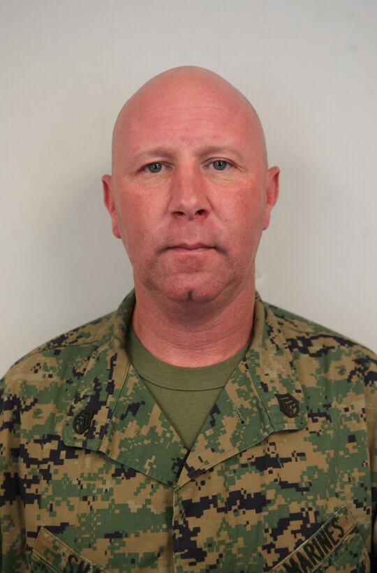 Staff Sgt. Brent M. Sharp, from Saint Paul, Minn., the 2nd Marine Logistics Group safety chief and motorcycle safety officer, poses for a picture Jan. 26, 2011, aboard Camp Lejeune, N.C.  According to Sharp, being a Marine is an honor, but being allowed to mix it with motorcycle-riding safety and mentoring is priceless.  All the courses he runs allows him to interact with the Marines and sailors, and mentor on a person-to-person level.  (Photo by Cpl. Bruno J. Bego)