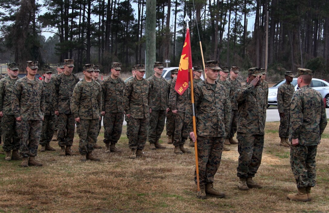 Marines with 2nd Marine Aircraft Wing's Military Police Company stand in formation for the last time Jan. 26 before de-activating during a ceremony at their headquarters building aboard Marine Corps Air Station Cherry Point. The company was activated on April 25, 2009 and comprised of a headquarters section and 4 platoons, located at Marine Corps Air Stations Beaufort, New River and Cherry Point. "This and all other MP Companies Marine Corps wide will be shutting down and consolidating in three large battalions that will be known as the 'Law Enforcement Battalion,'" said Capt. Jonathon C. Ajinga, the commanding officer of 2nd MAW MP Company. "Each of the Marine Expeditionary Forces will have a battalion of MP's. These Marines will be under the direct command of the MEF and will be assigned duties as seen fit."