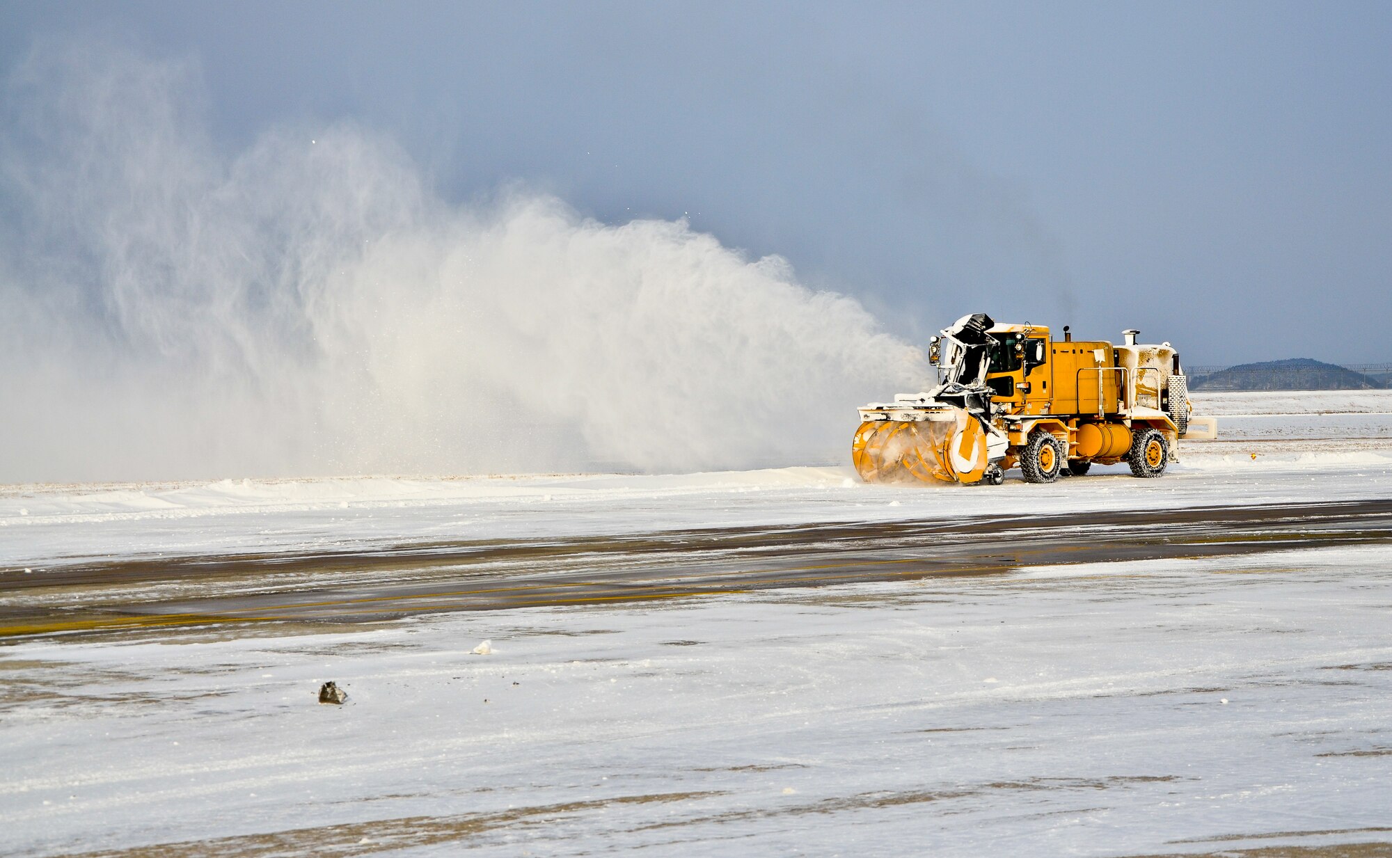 Crews from the 8th Civil Engineer Squadron worked quickly to remove snow from the flightline and around base in an effort to allow the Wolf Pack’s flying schedule to return to normal operations at Kunsan Air Base, Republic of Korea, Jan. 25, 2012. A winter storm swept across the Kunsan region Jan. 24 and 25 bringing more than three inches of snow and sub-freezing temperatures to the base and surrounding communities. (U.S. Air Force photo by Senior Airman Benjamin Stratton/Released)