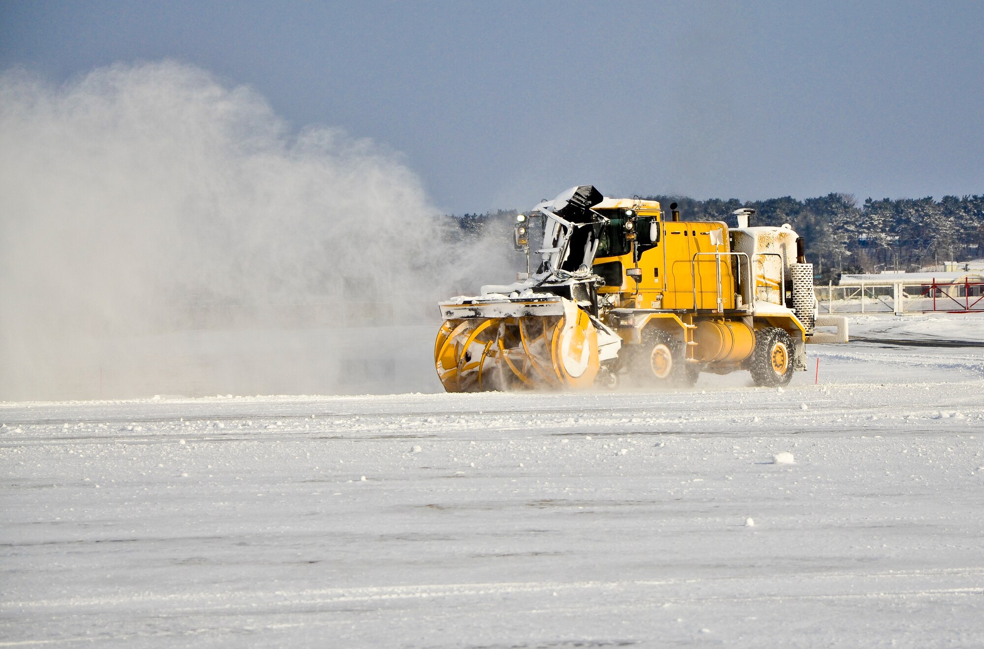 Crews from the 8th Civil Engineer Squadron worked quickly to remove snow from the flightline and around base in an effort to allow the Wolf Pack’s flying schedule to return to normal operations at Kunsan Air Base, Republic of Korea, Jan. 25, 2012. A winter storm swept across the Kunsan region Jan. 24 and 25 bringing more than three inches of snow and sub-freezing temperatures to the base and surrounding communities. (U.S. Air Force photo by Senior Airman Benjamin Stratton/Released)