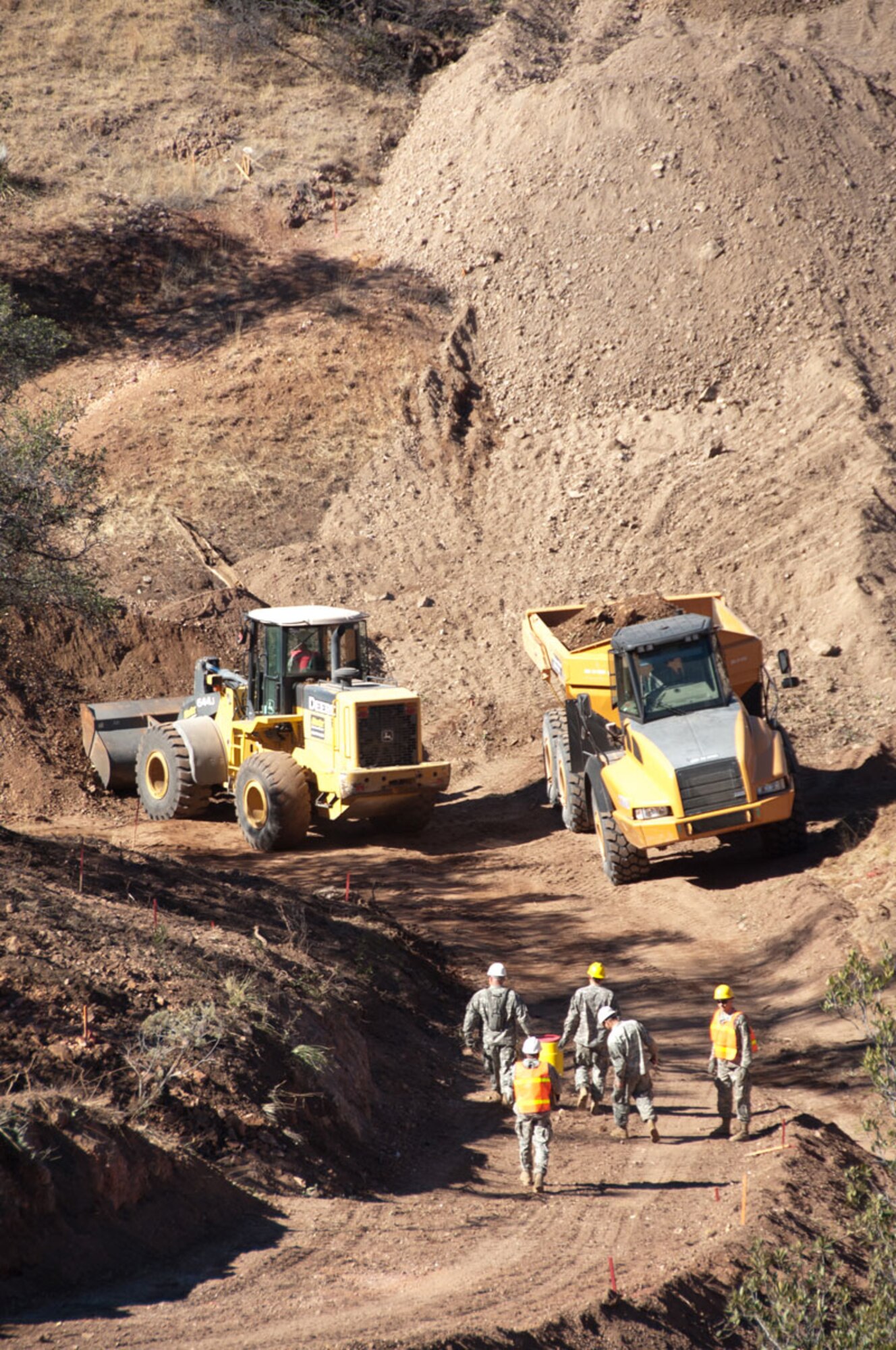 ABOVE: Soldiers of 84th Engineer Support Company build a road Jan. 20 for the U.S. Border Patrol, Tucson Sector.  (U.S. Army photos/Staff Sgt. Sun L. Vega)