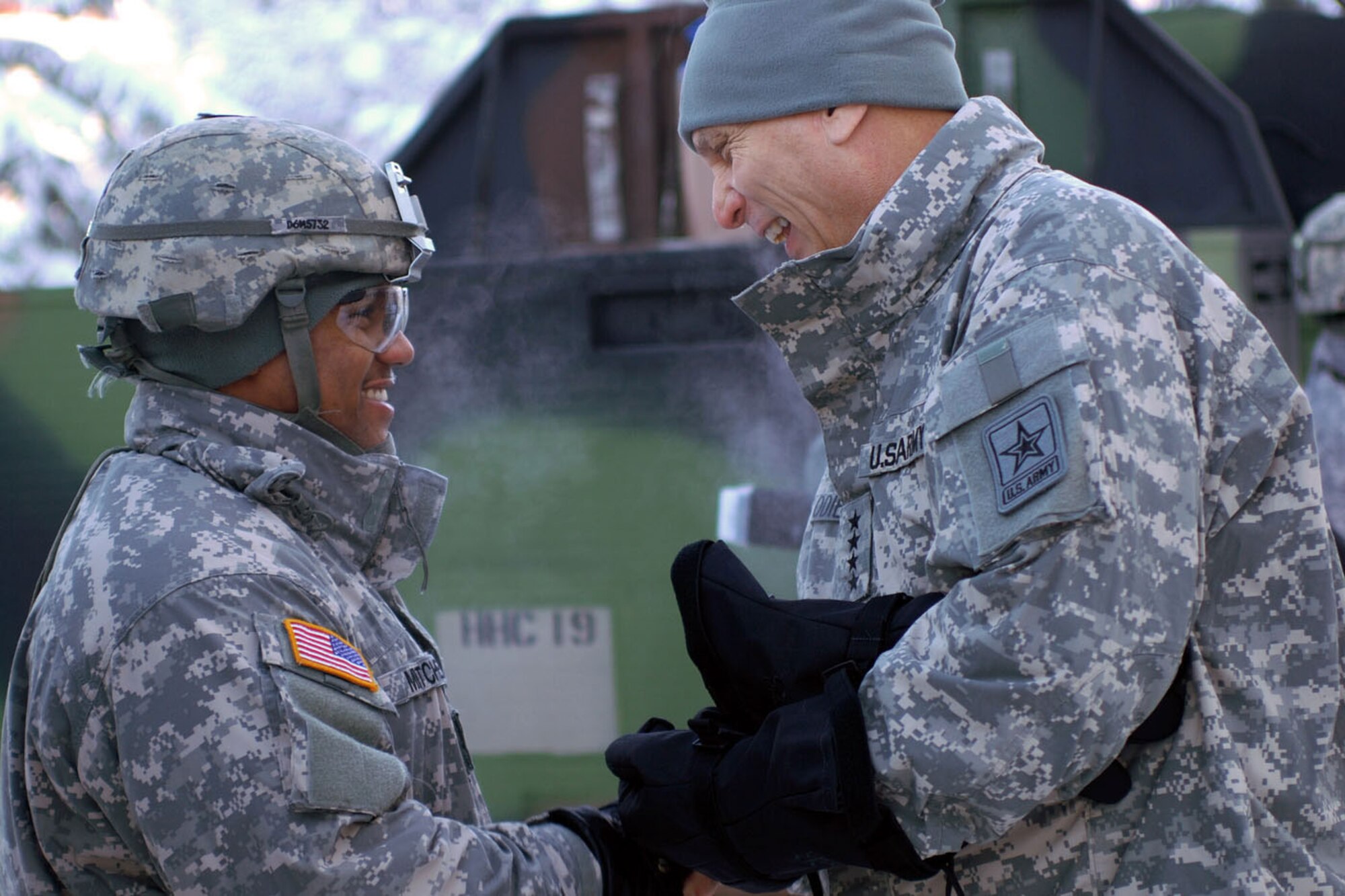 Gen. Raymond T. Odierno, Chief of Staff of the Army, presents a coin to Spc. Marchal Mitchell, 56th Engineer Company, 6th Engineer Battalion, during a visit to U.S. Army Alaska Headquarters at Joint Base Elmendorf-Richardson. (U.S. Army photo/Staff Sgt. Matthew Winstead)