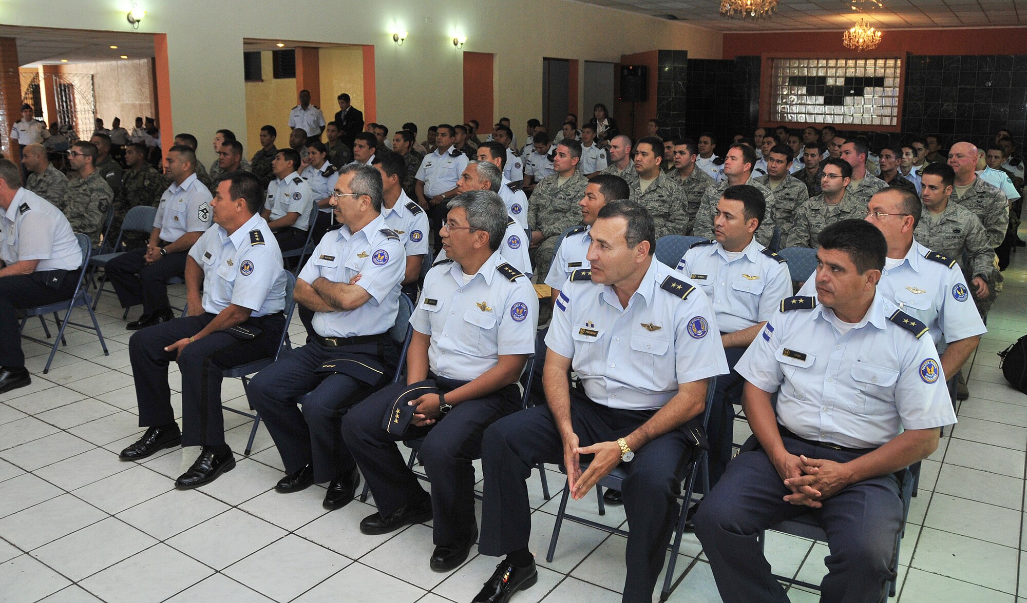 Airmen from the 571st Mobility Support Advisory Squadron and the Honduran Air Force listen to comments made by Lt. Gen. Robin Rand, Air Forces Southern Command commander, during the opening ceremony, Jan. 25.  The 571st's mission supports 12th Air Force's continued engagements in the U.S. Southern Command area of responsibility of Latin America and the Caribbean.  (U.S. Air Force photo by Tech. Sgt. Lesley Waters)