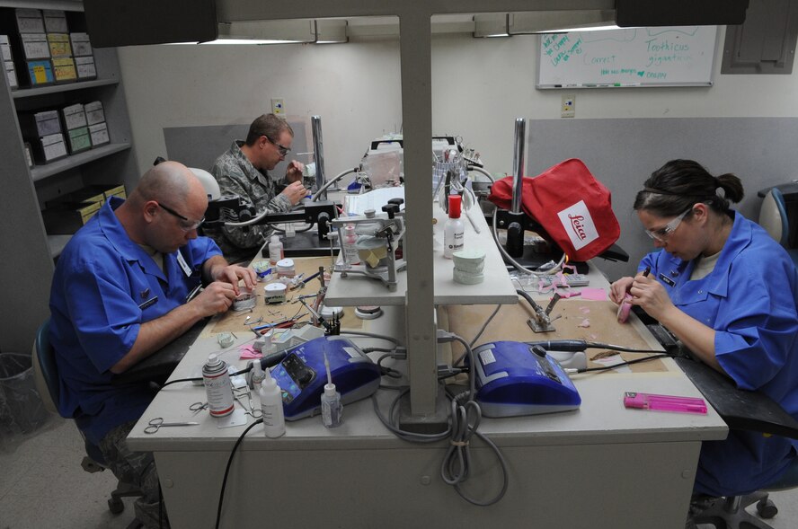 Dental lab technicians work on casts in the dental lab on Barksdale Air Force Base, La., Jan. 25. The dental lab makes implants, retainers, night and sports guards for military personnel. (U.S. Air Force photo/Airman 1st Class Micaiah Anthony)(RELEASED)