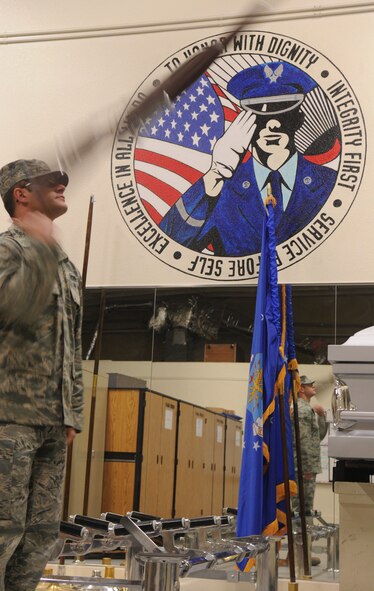 Senior Airman Joshua Ainslie, Beale Air Force Base Honor Guard, practices rifle drills at the honor guard facility on Beale Air Force Base, Calif., Jan. 24, 2012. Ainslie serves as an honor guard trainer and is a member of the firing party. (U.S. Air Force photo by Airman 1st Class Stephanie Lovito/ Released)	