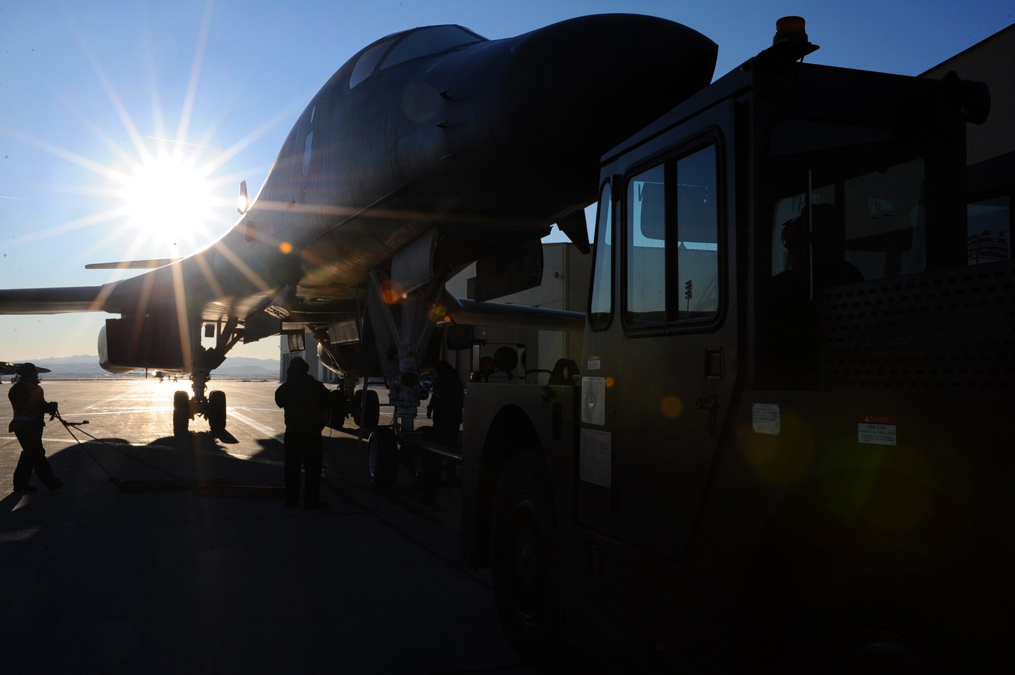 Members of the 28th Aircraft Maintenance Squadron field team tow a B-1B on the flightline at Ellsworth Air Force Base, S.D., Jan. 17, 2012. Ellsworth aircrews deployed to Southwest Asia provided critical air presence, precision strike, and surveillance and reconnaissance capabilities to support military objectives in the region for several months. (U.S. Air Force photo by Airman 1st Class Zachary Hada/Released)
