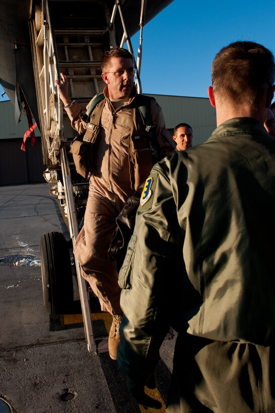 Col. Steven Hiss, 28th Bomb Wing vice commander, exits a B-1B after returning from Southwest Asia at Ellsworth Air Force Base, S.D., Jan. 17, 2012. Hiss and 12 34th Bomb Squadron aircrew members flew base B-1 bombers home as part of the Air Expeditionary Force rotation process. (U.S. Air Force photo by Airman 1st Class Kate Thornton/Released)
