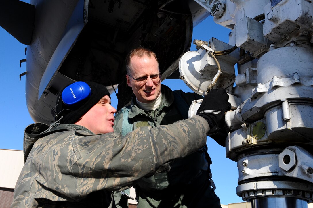 Col. Mark Weatherington, 28th Bomb Wing commander, performs a walk around inspection of a B-1B with Airman 1st Class Daryl Ackerman, 37th Bomb Squadron crew chief at Ellsworth Air Force Base, S.D., Jan. 17, 2012. Inspections are performed to ensure landing gear pins and handles are properly removed and stored, while searching for any foreign object debris around the aircraft, and checking for leaks that may impede flight. (U.S. Air Force photo by Airman 1st Class Zachary Hada/Released)