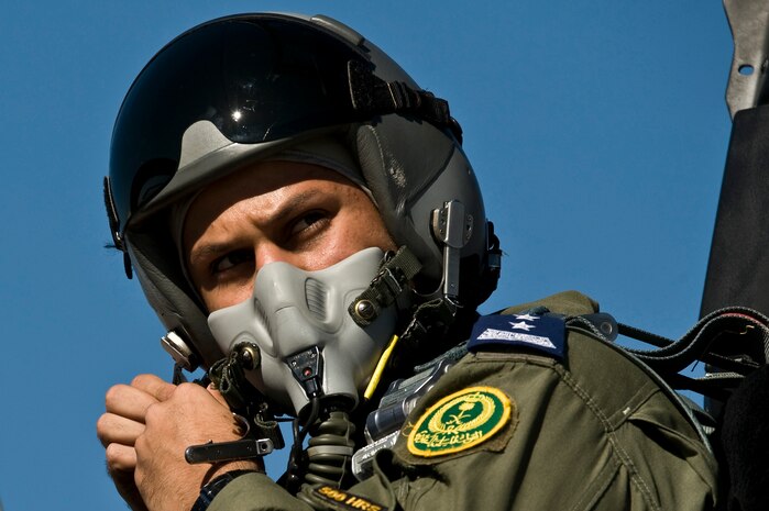 Royal Saudi Air Force Capt. Mohsen, F-15 Strike Eagle pilot, adjusts his flight helmet before a training mission during Red Flag 12-2 Jan. 25, 2012, at Nellis Air Force Base, Nev. Red Flag is a realistic combat training exercise involving the air forces of the United States and its allies. The exercise is hosted north of Las Vegas on the Nevada Test and Training Range. (U.S. Air Force photo by Senior Airman Brett Clashman)