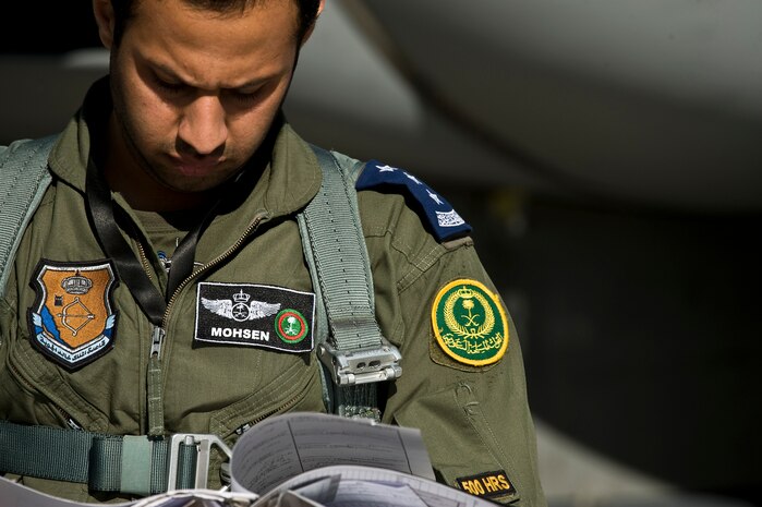 Royal Saudi Air Force Capt. Mohsen, F-15 Strike Eagle pilot looks over a flight log before a training mission during Red Flag 12-2 Jan. 25, 2012, at Nellis Air Force Base, Nev. Red Flag is a realistic combat training exercise involving the air forces of the United States and its allies. The exercise is hosted north of Las Vegas on the Nevada Test and Training Range. (U.S. Air Force photo by Senior Airman Brett Clashman)
