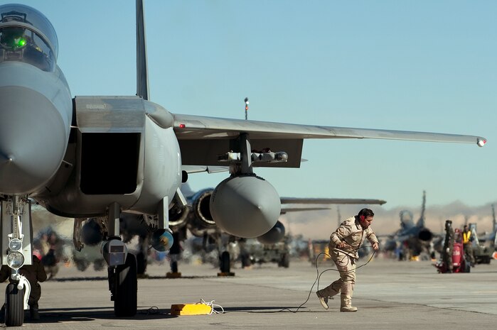 A Royal Saudi Air Force crew chief, pulls chaulks away from an F-15E Strike Eagle during Red Flag 12-2 Jan. 25, 2012, at Nellis Air Force Base, Nev. Red Flag is a realistic combat training exercise involving the air forces of the United States and its allies. The exercise is hosted north of Las Vegas on the Nevada Test and Training Range.(U.S. Air Force photo by Staff Sgt. Christopher Hubenthal) 