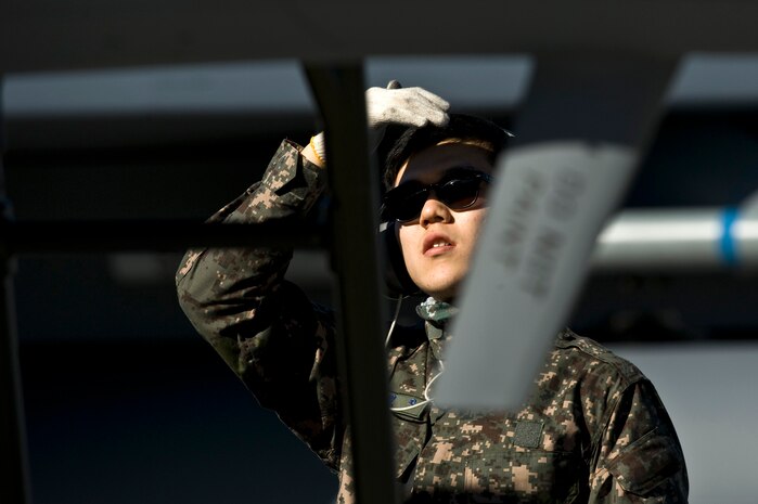 Republic of Korea Air Force Tech. Sgt. Yoon Wei-Fei, crew chief, looks over an F-15 Strike Eagle during Red Flag 12-2 Jan. 25, 2012, at Nellis Air Force Base, Nev. Red Flag is a realistic combat training exercise involving the air forces of the United States and its allies. The exercise is hosted north of Las Vegas on the Nevada Test and Training Range. (U.S. Air Force photo by Senior Airman Brett Clashman)
