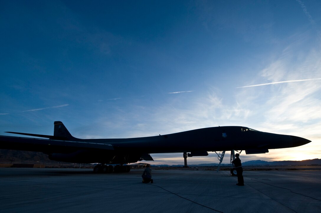 U.S. Air Force Airmen, 28th Aircraft Maintenance Squadron, Ellsworth Air Force Base, S.D., perform pre-flight checks on a B-1B Lancer during Red Flag 12-2 Jan. 24, 2012, at Nellis AFB, Nev. Red Flag is a realistic combat training exercise involving the air forces of the United States and its allies. The exercise is hosted north of Las Vegas on the Nevada Test and Training Range. (U.S. Air Force photo by Senior Airman Brett Clashman)