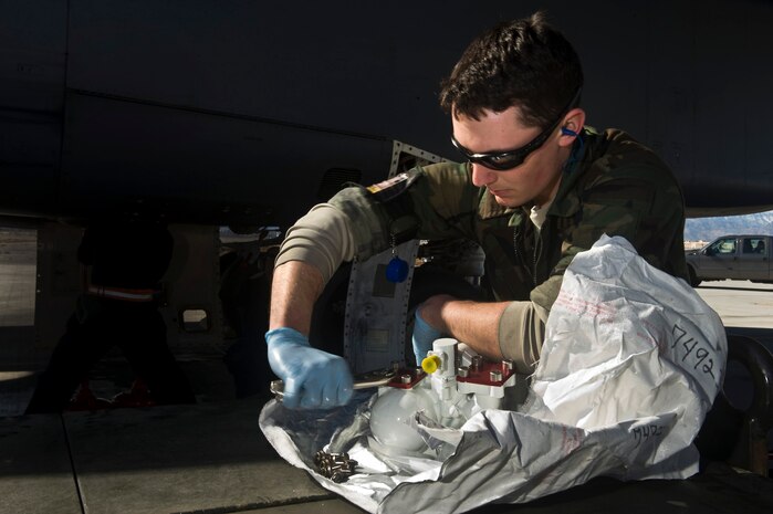 U.S. Air Force Airman 1st Class Brandon Wood, 28th Aircraft Maintenance Squadron aerospace propulsion apprentice, Ellsworth Air Force Base, S.D., prepares a hydraulic pump for installation during Red Flag 12-2 Jan. 24, 2012, at Nellis Air Force Base, Nev. Red Flag is a realistic combat training exercise involving the air forces of the United States and its allies. The exercise is hosted north of Las Vegas on the Nevada Test and Training Range. (U.S. Air Force photo by Senior Airman Brett Clashman)